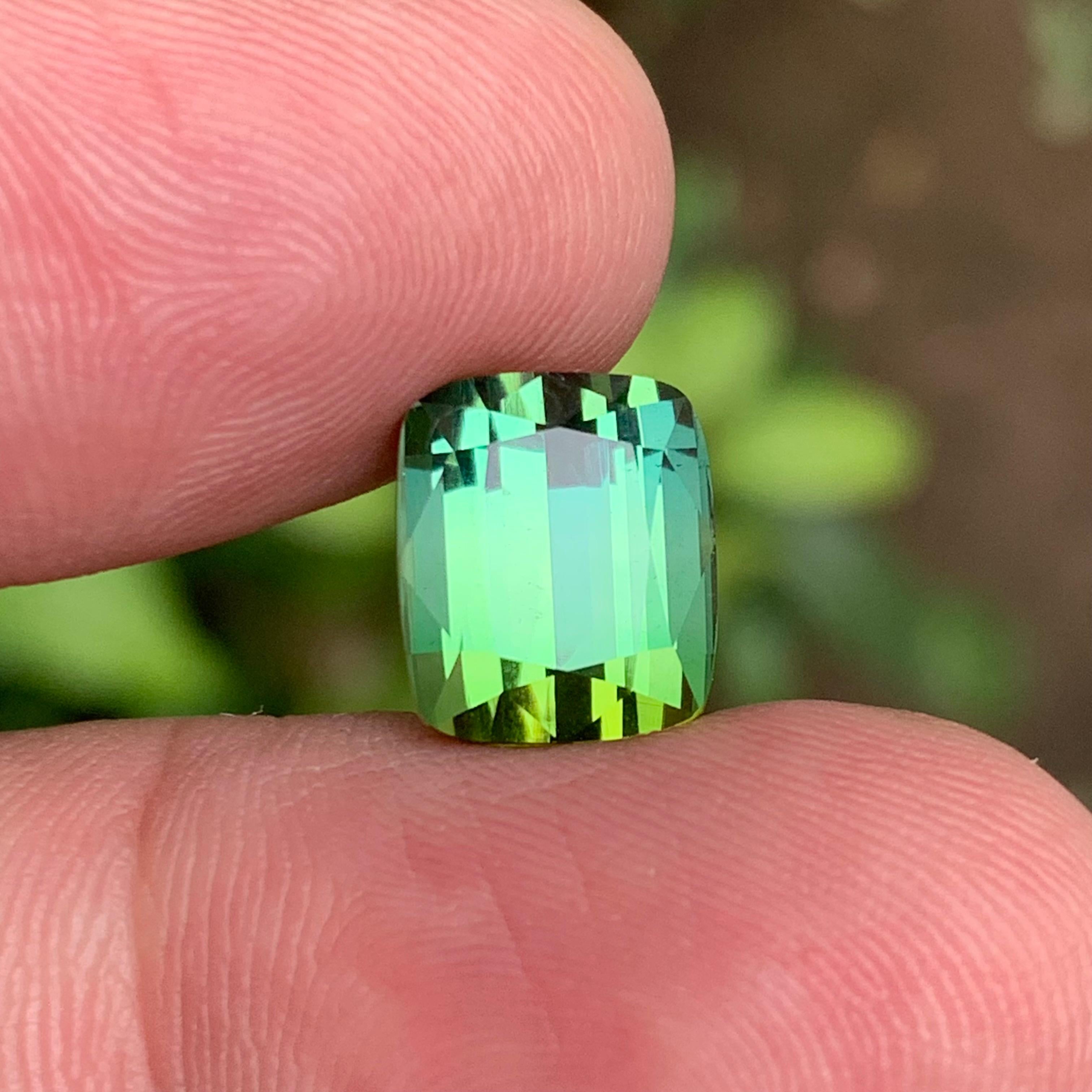 Stunning 6.50 Carat Natural Tourmaline  Two-Tone Lime Green  Cushion Cut from Afghanistan
 
💎 GEMSTONE TYPE: Tourmaline
⚖️ WEIGHT: 6.50 Carats
🪚 SHAPE & CUT: Cushion Cut
📏 SIZE (MM): 10.74 x 9.18 x 7.62
🌈 COLOR: Lime Green Two Tone
🔎 CLARITY: