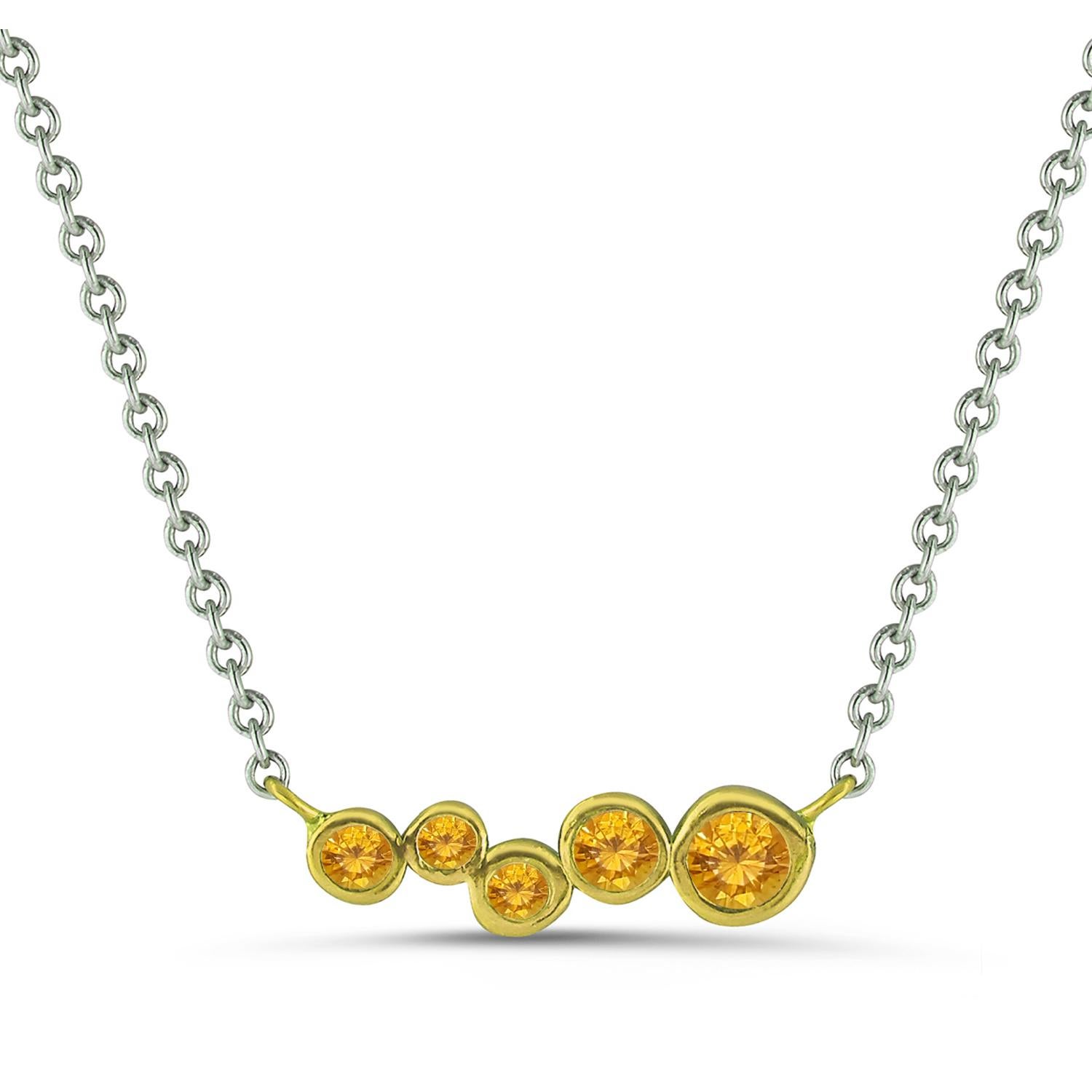 Hi June Parker's version of the classic bar pendant sprinkled with tapering sizes of Yellow Sapphire stones ceramic plated with Lime Yellow to add a pop of electric color to your neck.

Inspired by seeing the cross-section view of life, as if