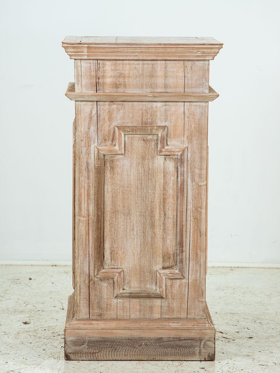Crafted in mid-20th century England, this English oak pedestal exudes timeless elegance with its decorative limed finish. Adorned with applied mouldings in a captivating lozenge pattern on all four sides, it serves as a sophisticated stage to