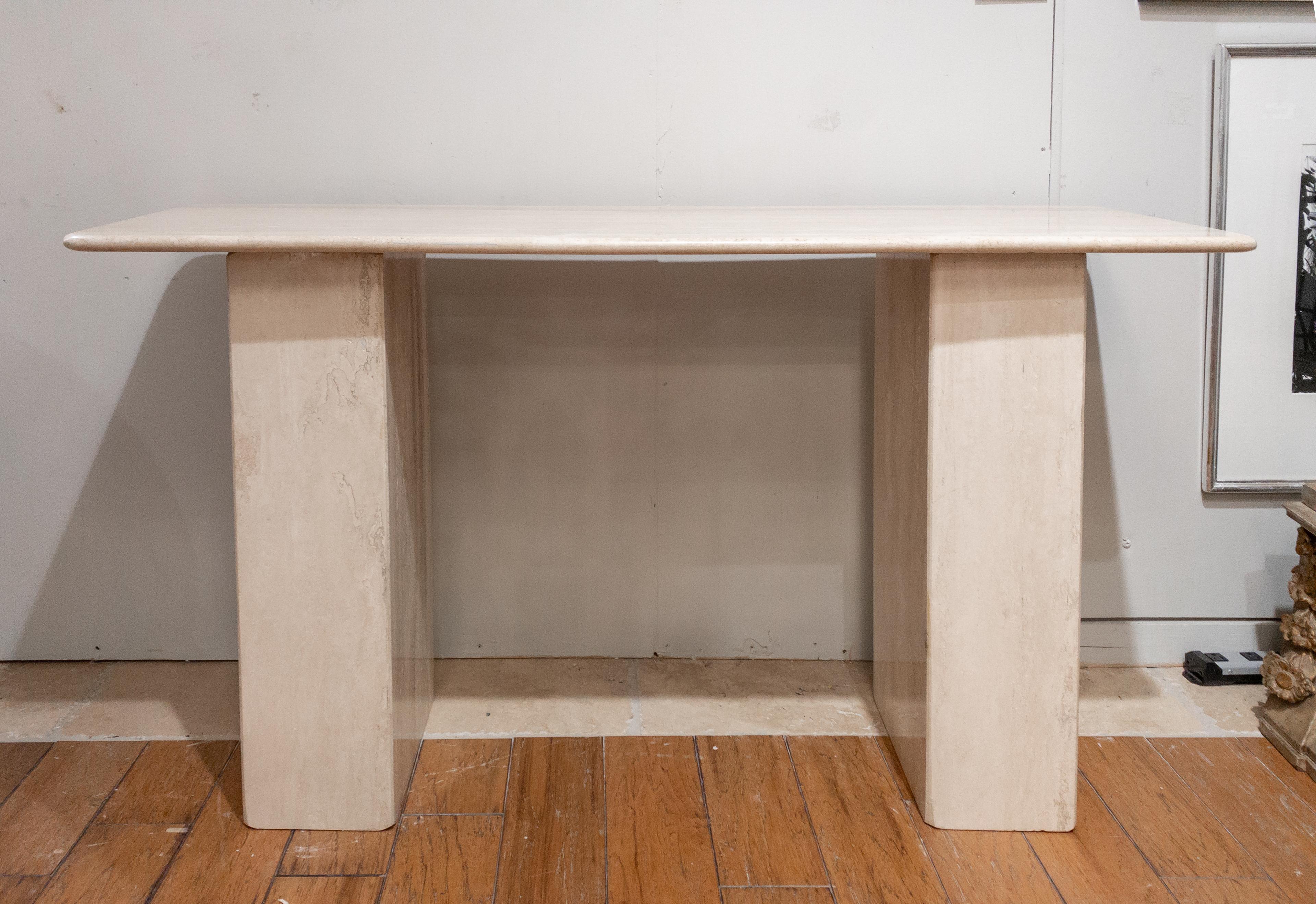 Limestone Console Table
Made of cut and polished limestone slabs assembled into three separate components.