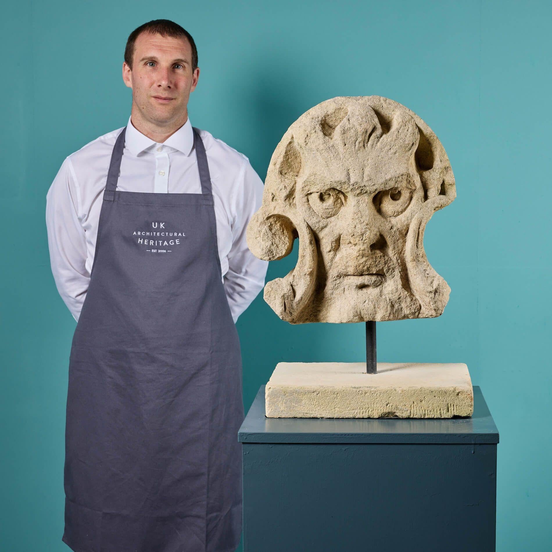 This engaging antique grotesque or demonic mask is quite the decorative piece. Hand carved into limestone, its details are superbly distinctive, the eyes appearing to follow you as you move around the room…

Portraying a hellfire or God-like