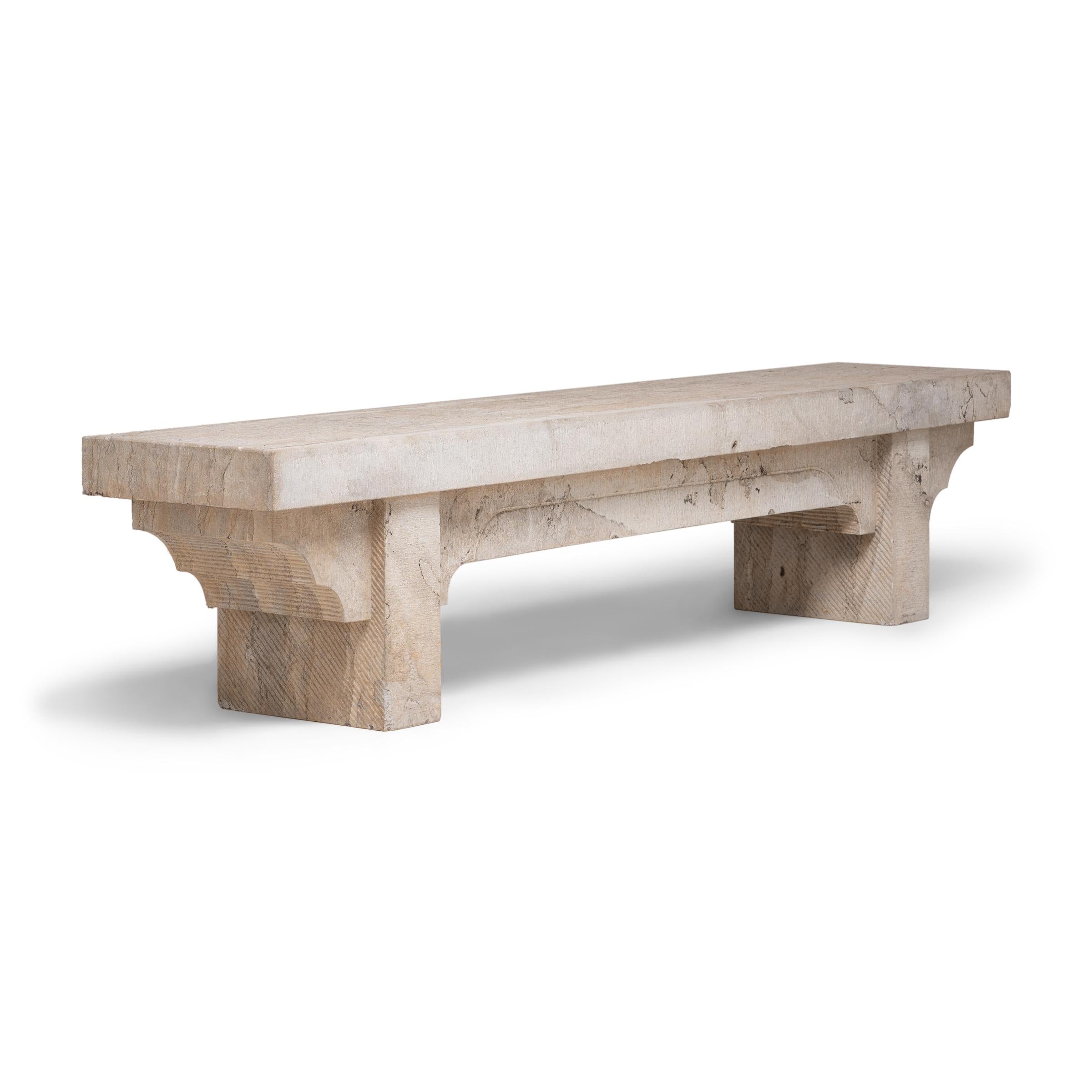 This simply designed Doon bench from China's Shanxi province was hand-crafted from a single block of limestone. With a strong, low profile and subtle stepped spandrels, the bench honors the balanced proportions and minimal forms characteristic of