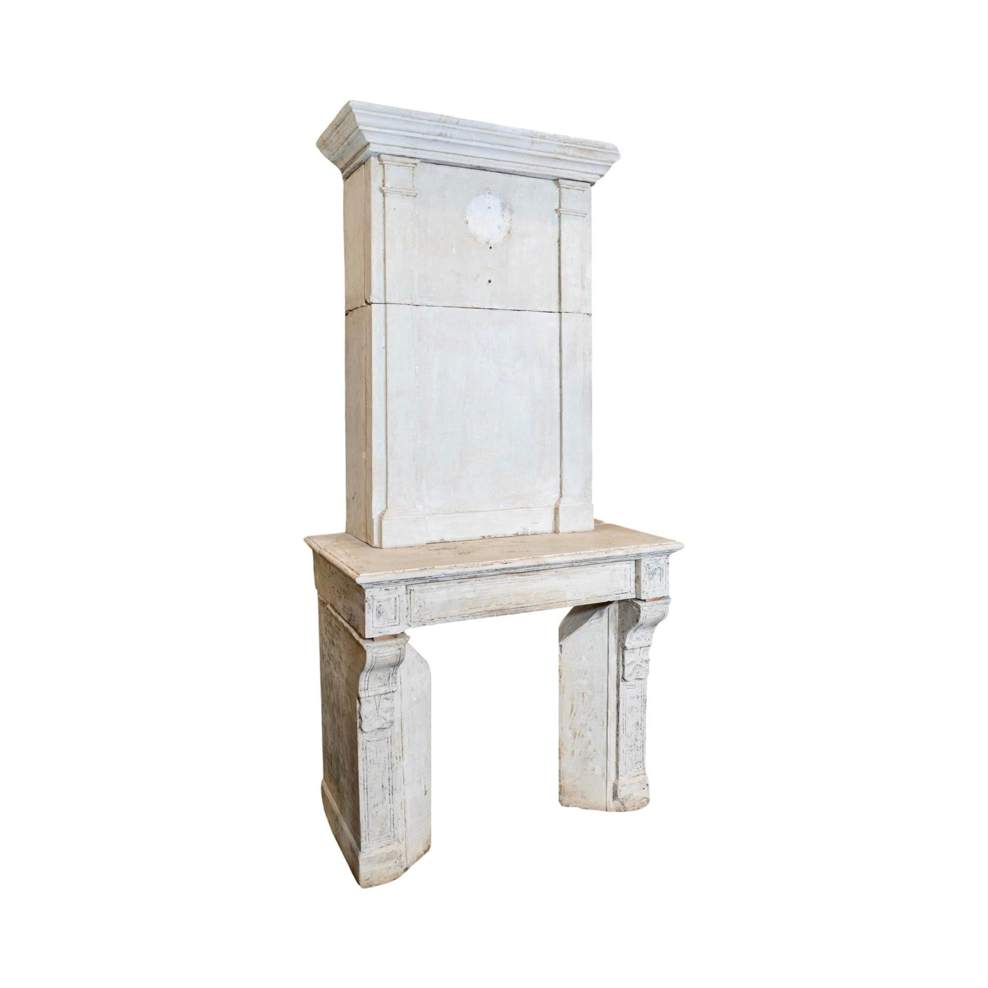 This elegant French Limestone Fireplace, originating from France circa 1820, features intricate line carving details throughout the mantel. Crafted from high-quality limestone, this fireplace will add a touch of sophistication and charm to any