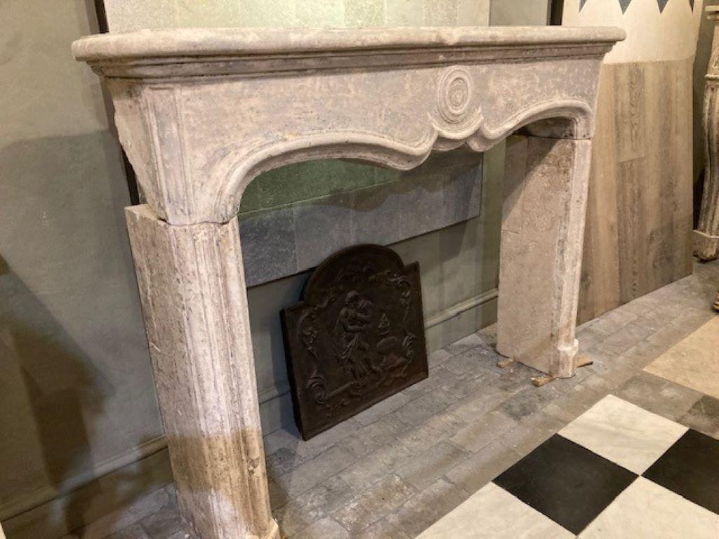 Carved Limestone Fireplace Mantel, dating from the Beginning of the 19th Century For Sale