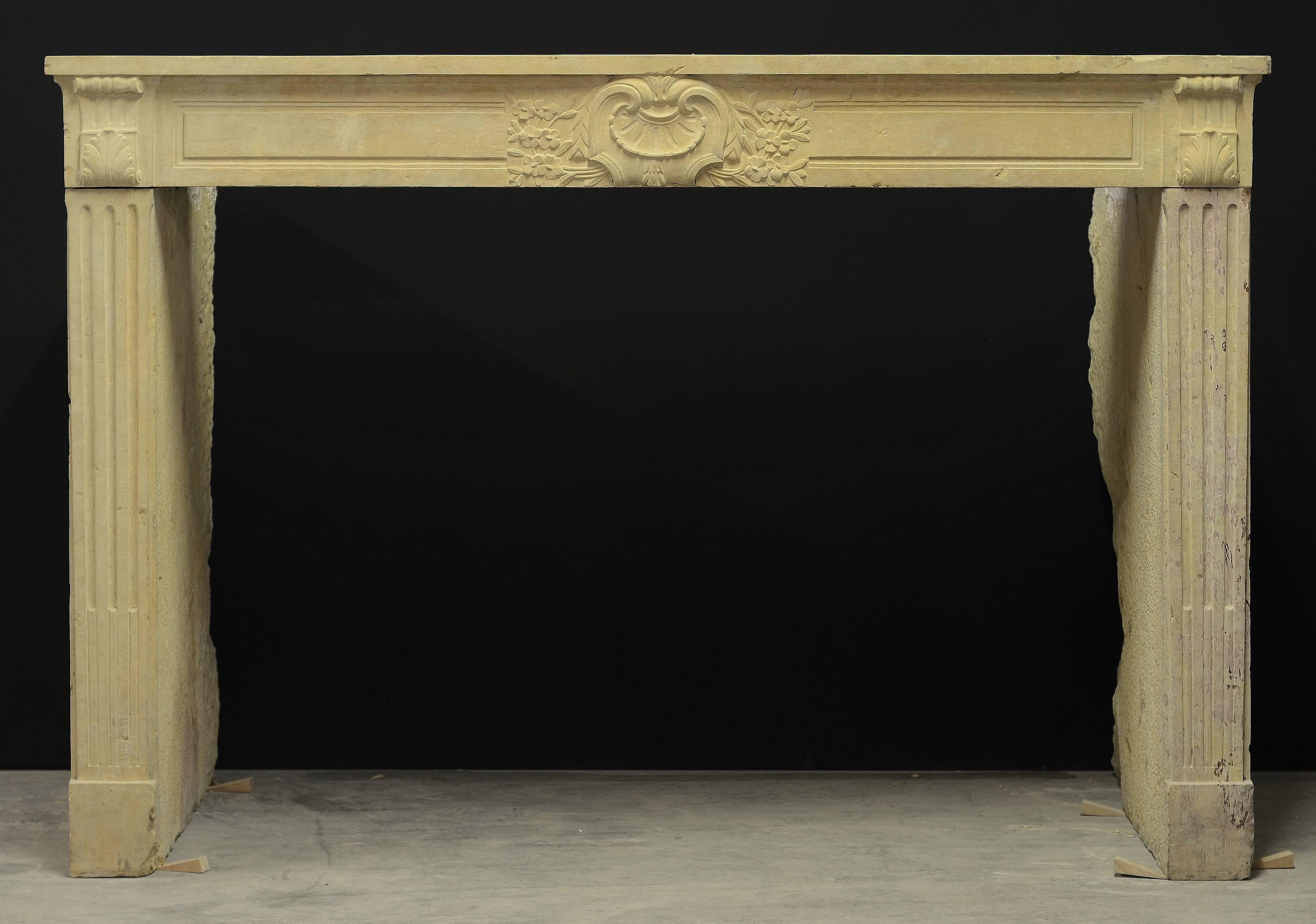 Solid 19th century Louis XVI limestone fireplace.

Comes with deep returns.
Opening measurements: 38.2 x 54.7 inch (height x width).