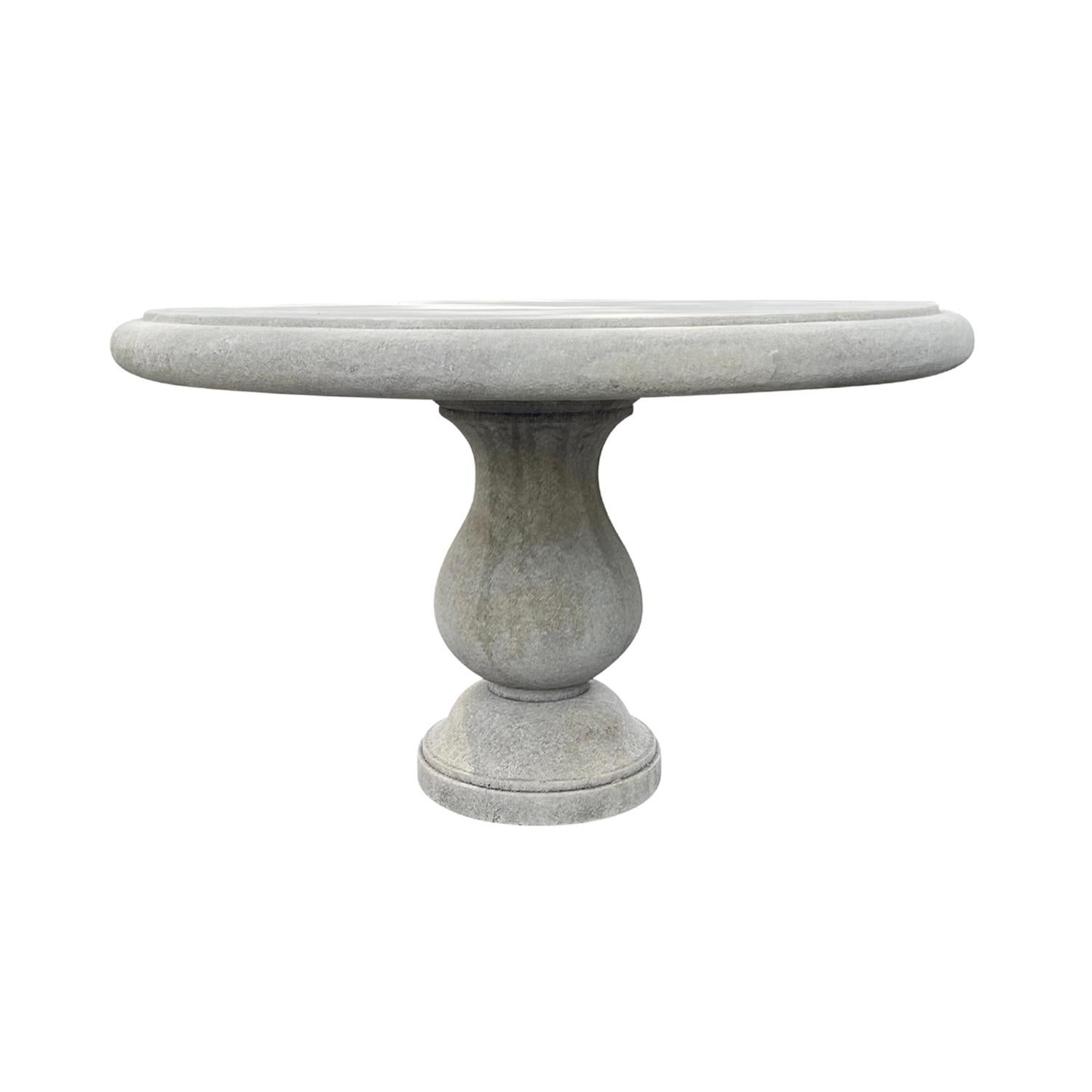A round garden table hand carved in limestone with a 3.5