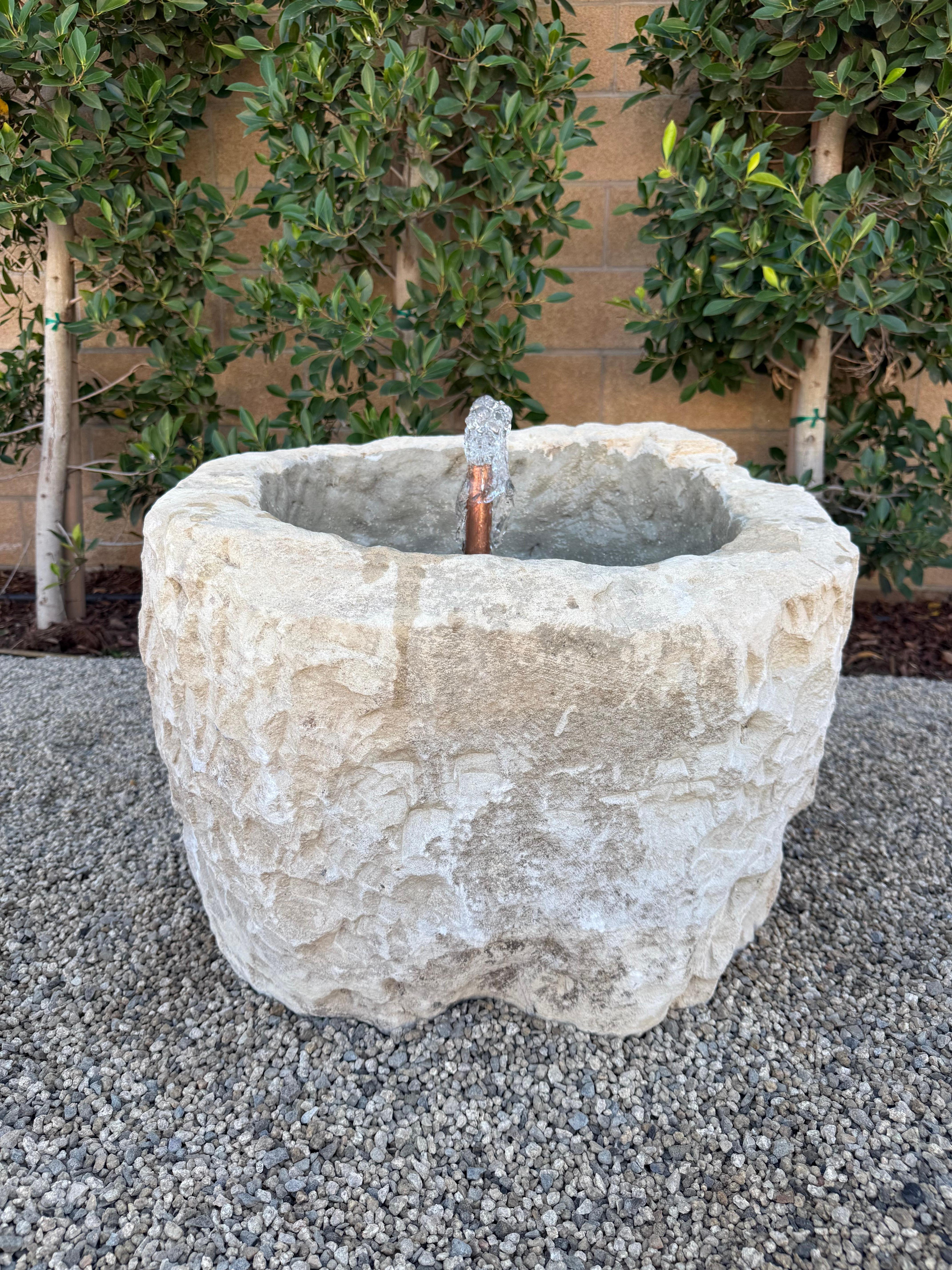 We've transformed this beautiful large limestone trough into a fountain, using copper piping that will patina even more over time turning a rich brown color. This fountain has the option to use the lights we included, There is an on-off switch for