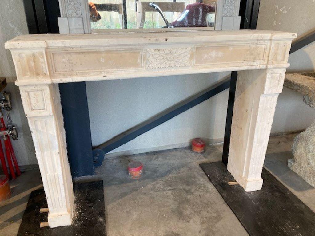 Carved Limestone Trumeau Fireplace Mantel with Mirror For Sale