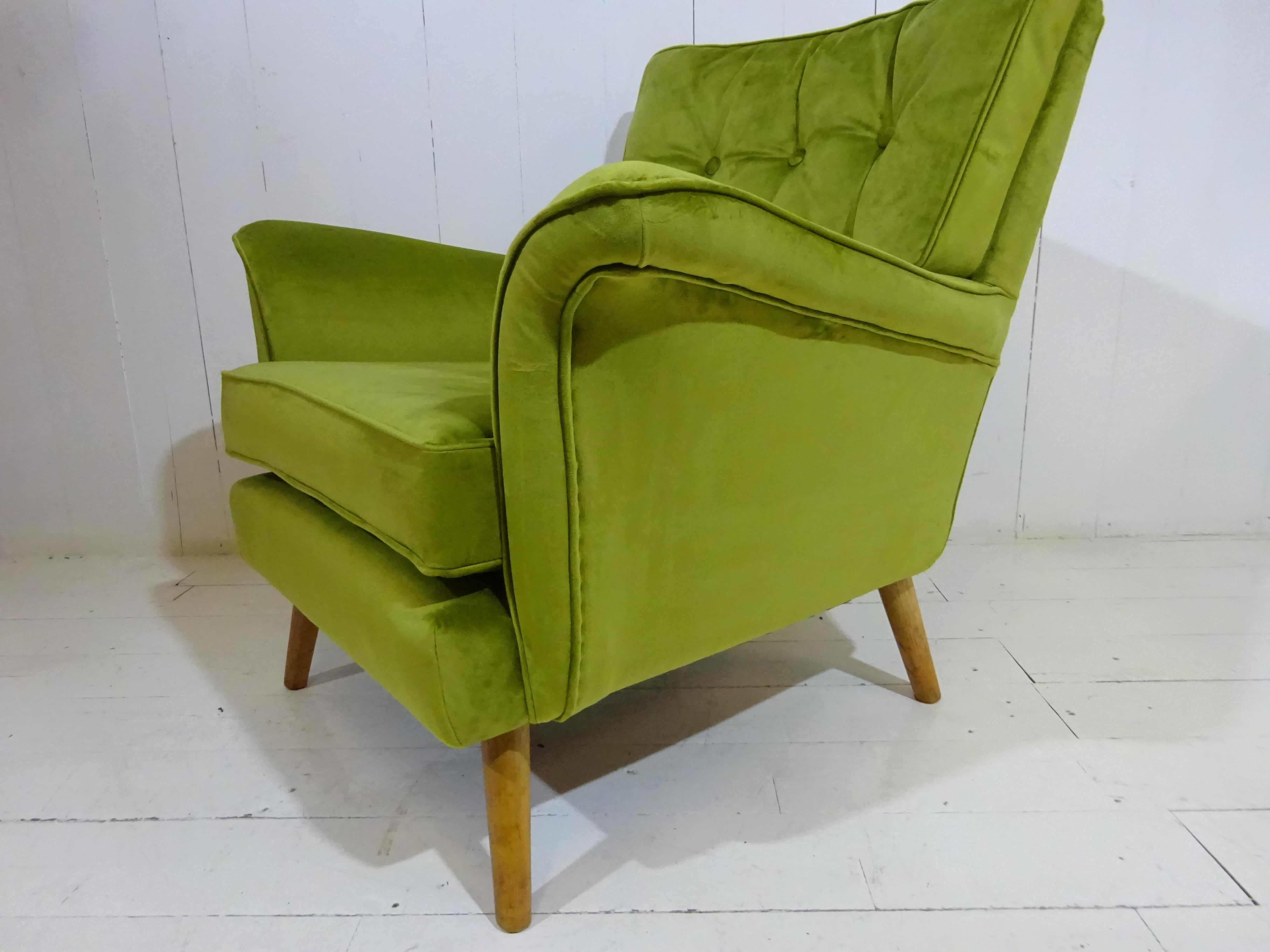 Lounge chair 
Absolutely stunning lounge armchair dated circa 1950. Designed, manufactured, stamped and distributed by H. Vaughan of Spital Fields, London, UK. 
History
Shoreditch and Bethnal Green were traditionally the centre of the furniture