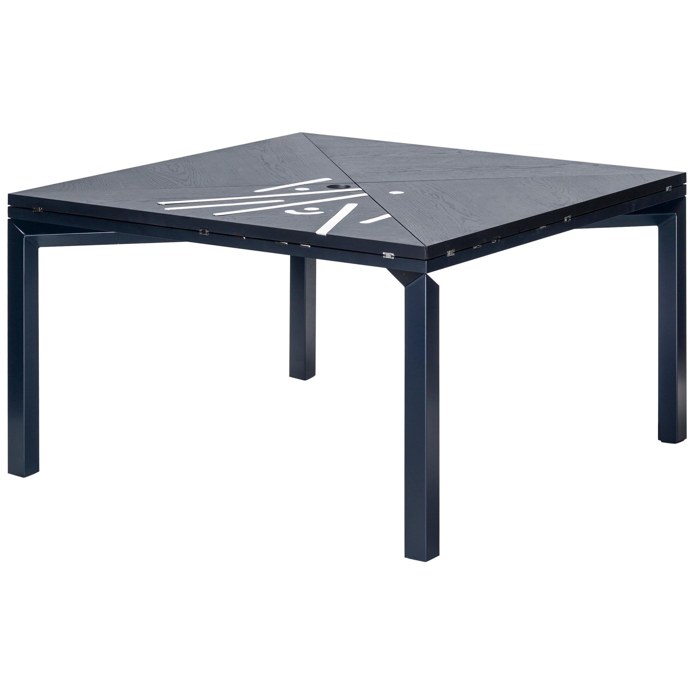 Alella table designed by Lluis Clotet.

Limited edition of 8 units, 2 artist proofs and 2 prototypes.
DM, oak veneered and stained in dark blue RAL 5004.
Legs in an iron rectangular tube lacquered in the same color as the top.
Decorative
