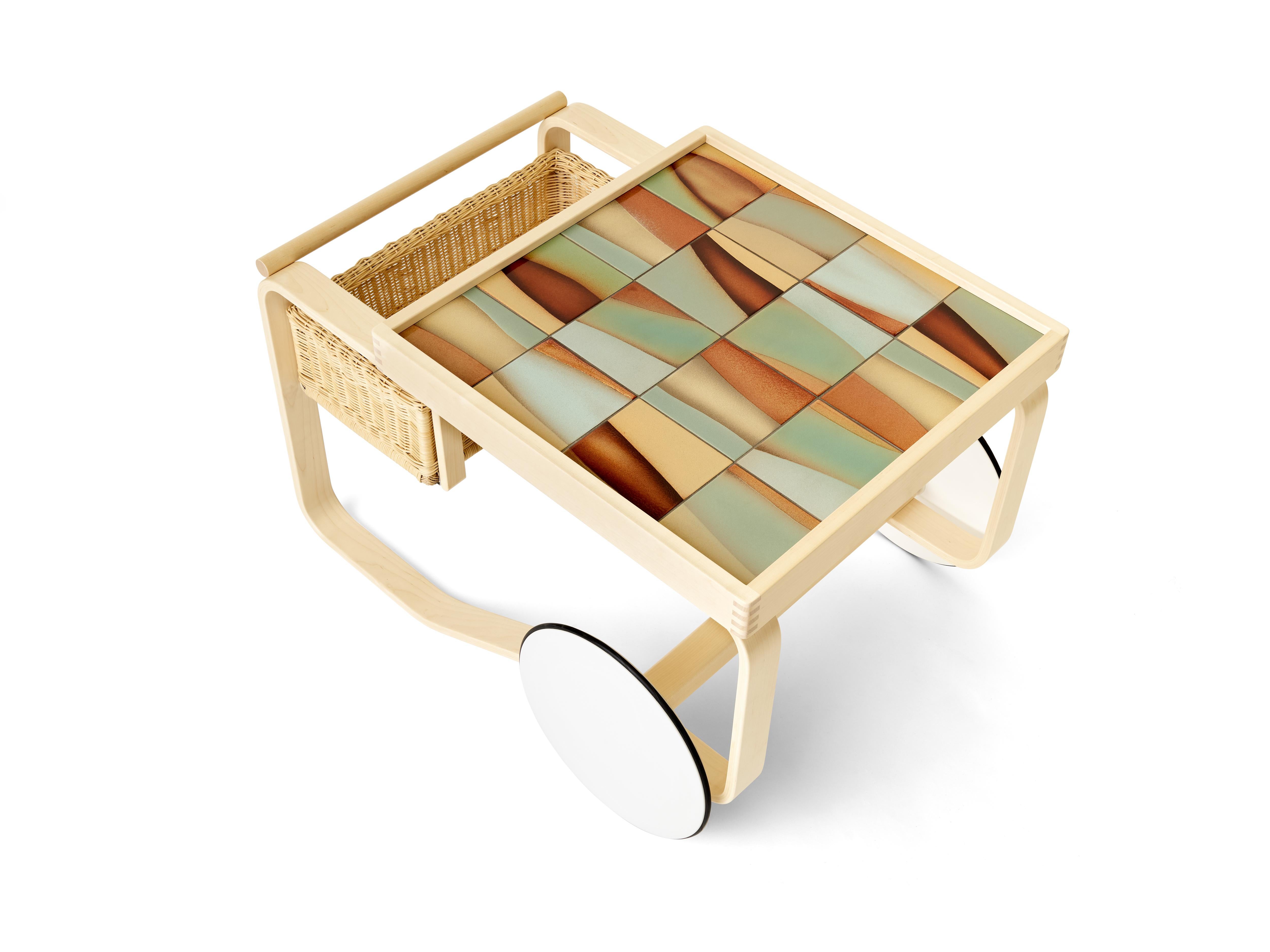 As an edition of six designs with only six of each made, Artek's iconic Tea Trolley is inlaid with Heath tile in “Landscape,” inspired by vintage tile installations found around their Sausalito factory and invoking a hilly Western landscape.