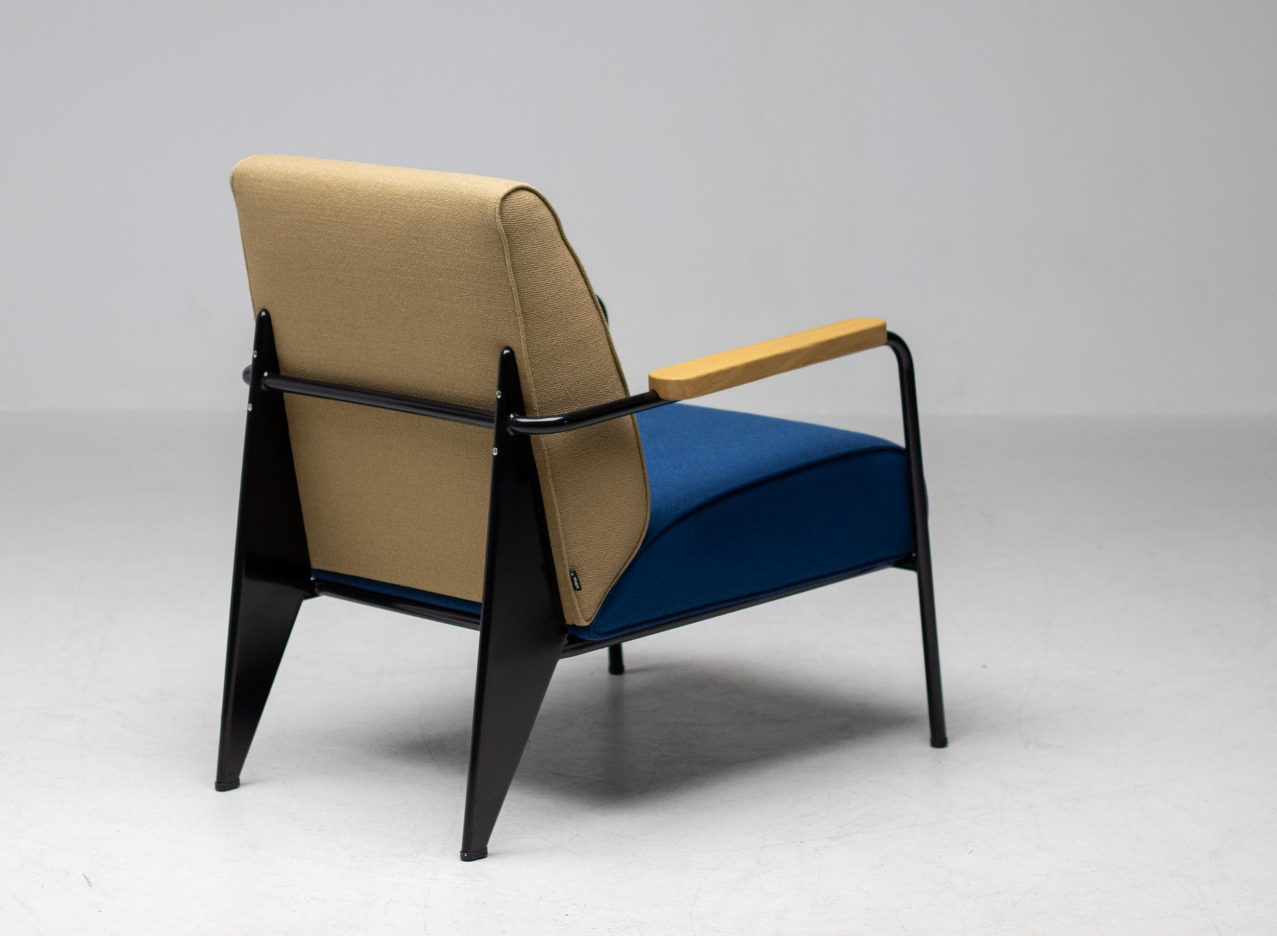 Limited edition Fauteuil de Salon, designed by Jean Prouvé in 1939.
Made by Vitra in 2018, in beautiful cream and blue fabric with black enameled frame and oak armrests. 
This configuration was a special order for the reception area of a large