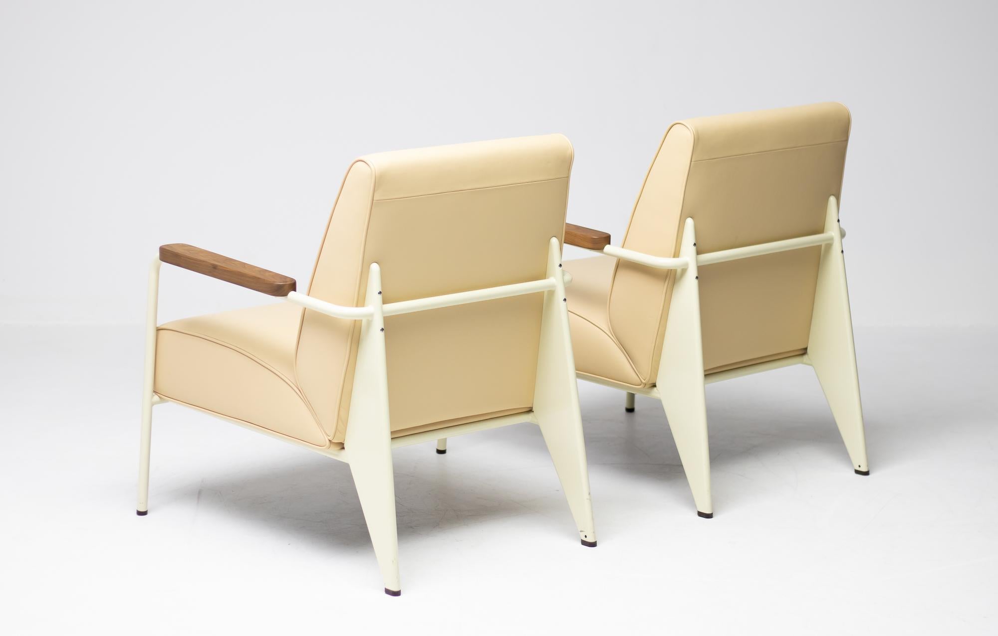 Limited edition Fauteuil de Salon, designed by Jean Prouvé in 1939.
Made by Vitra in 2018, in beautiful cream leather with very light lime frame and walnut armrests. 
The chairs where never used but only exhibited in a museum setting.
Marked with