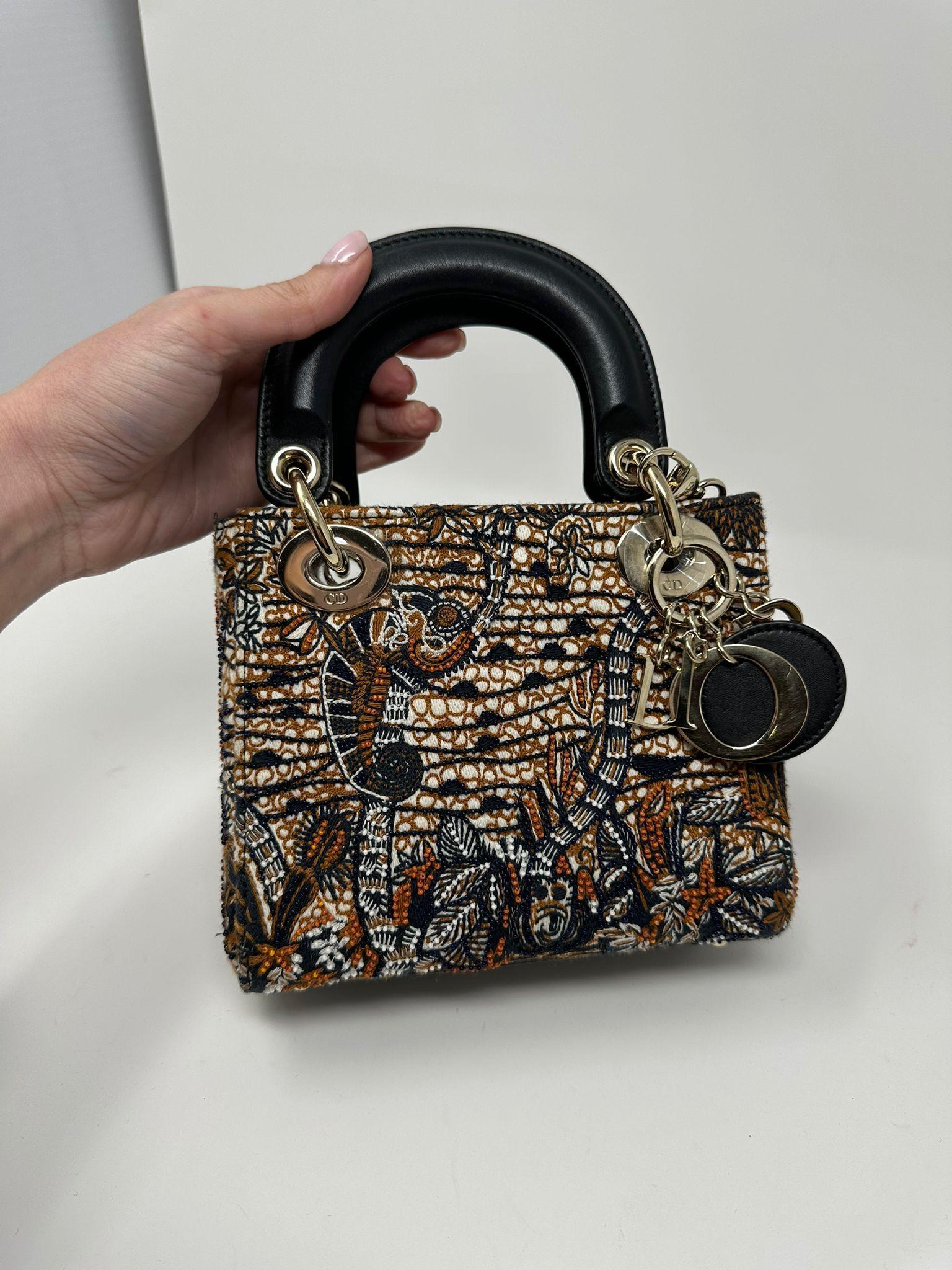 Dior Limited Edition Multicolor Beaded Canvas and Lamb Skin Mini Lady Dior Champaign Gold Hardware 

-Featured during the Spring 2020 Collection 
-Detachable chain strap 
-Beaded design body 
-Rolled leather top handles 
-Lined with tonal leather