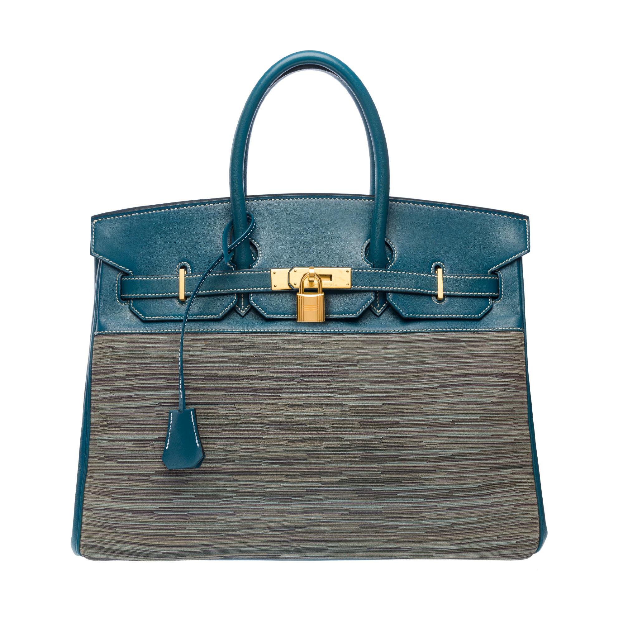 Limited Edition and Rare Hermes Birkin 35 in Blue Thalassa  calf leather, brushed gold metal trim, double handle in blue leather allowing a hand carry

Flap closure
Blue leather inner lining, a zippered pocket, a patch pocket
Signature: 