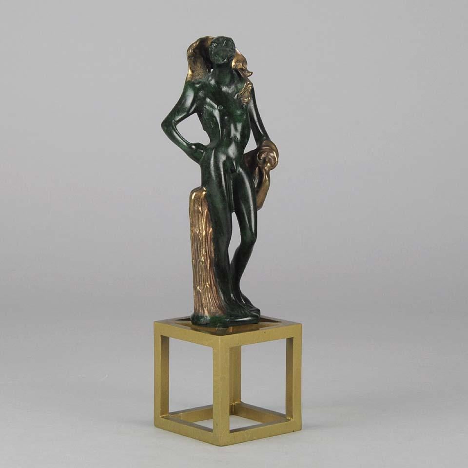 An intriguing late 20th century Limited Edition bronze study of a half man, half bird figure standing on a four legged stool. The surface of the bronze patinated with a deep green color heightened with bright gilding. Signed Dali numbered 239/350