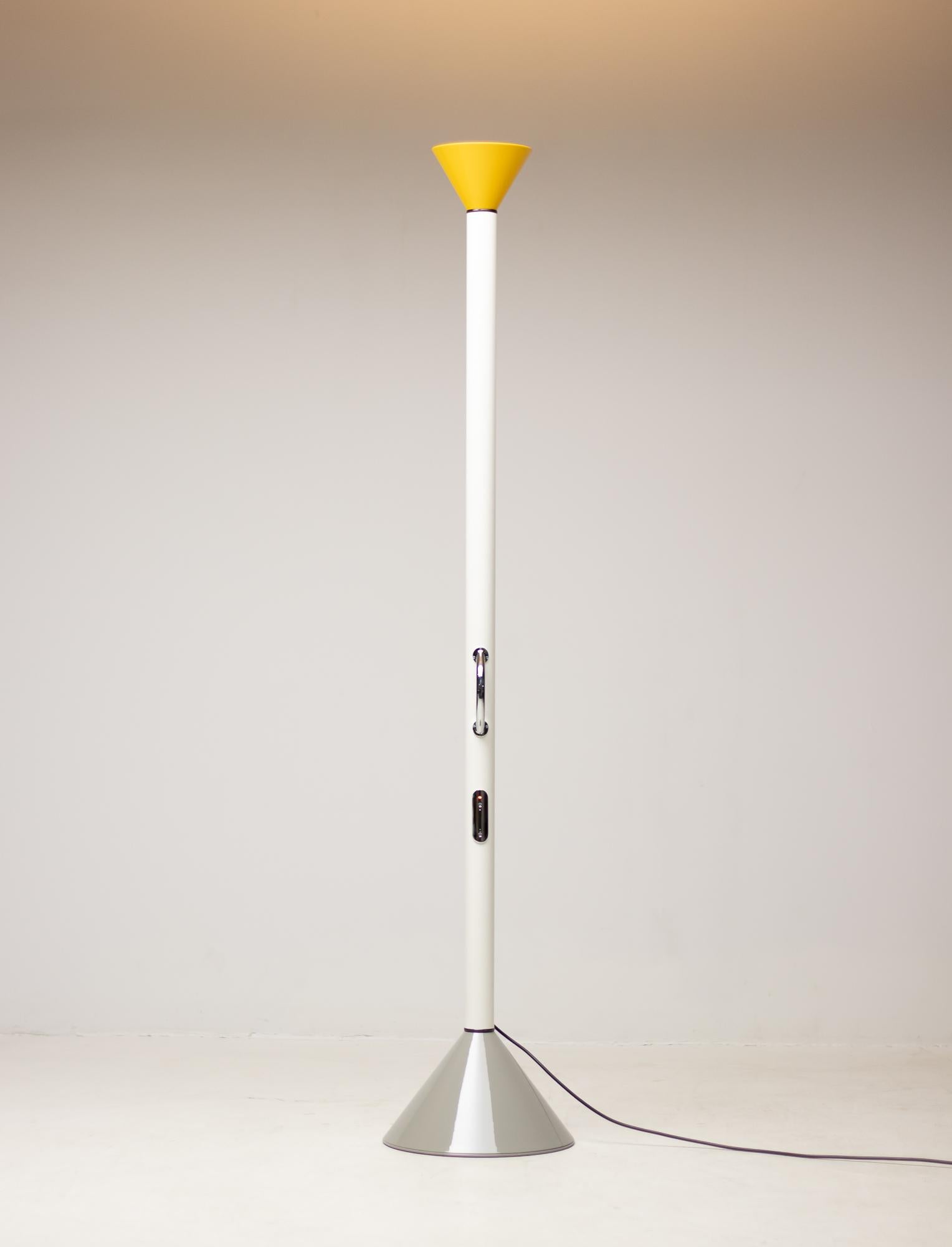 Limited Edition Callimaco floor lamp by Ettore Sottsass in grey, white and yellow.
Callimaco was designed by Ettore Sottsass for Artemide in 1982 and became a true icon of 1980s.
It's an uplighter in LED version.

The lamp lacks all unnecessary