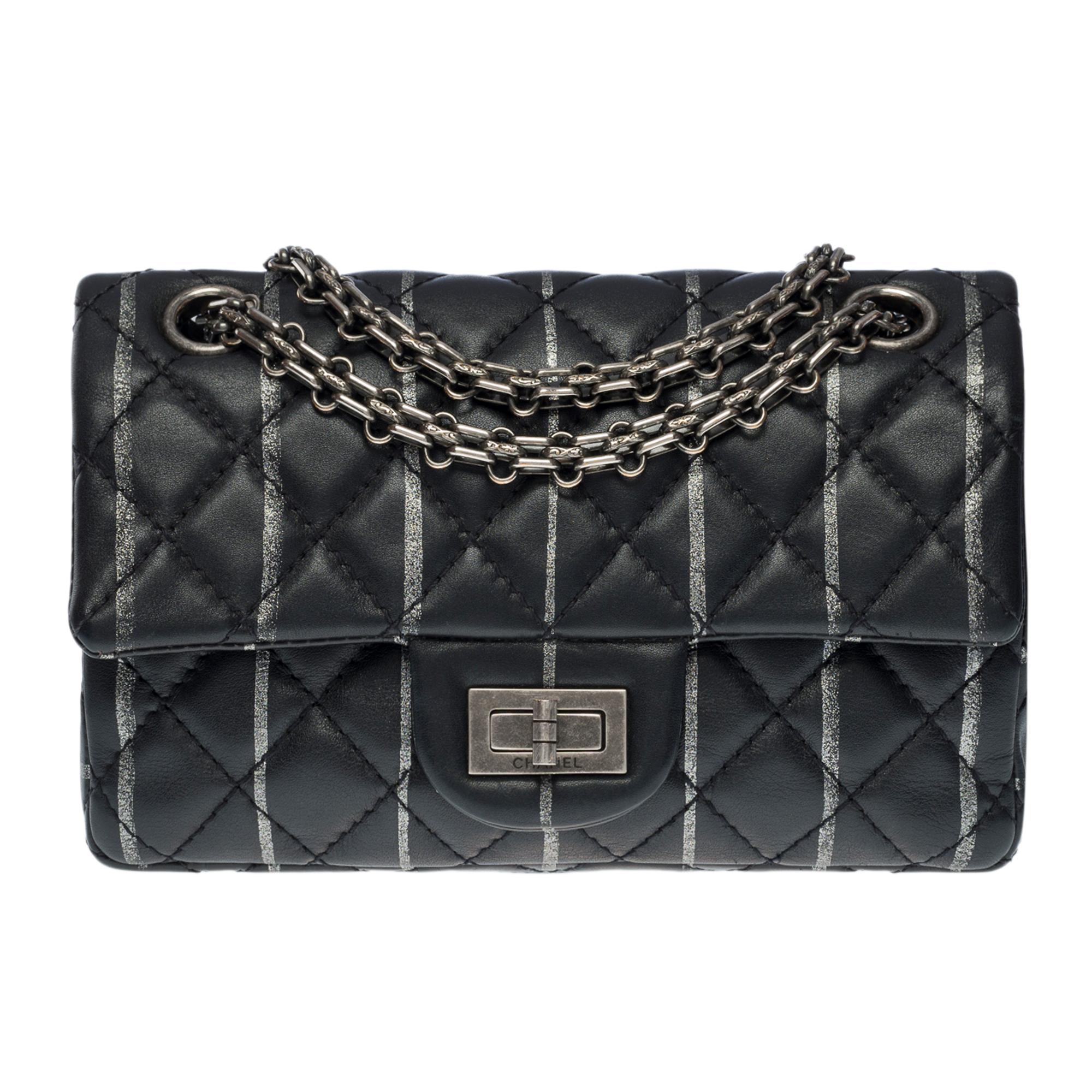 Exceptional Limited Edition Chanel 2.55 Mini shoulder bag in black quilted lambskin leather with metallic silver vertical stripes, silver metal hardware a silver chain handle Mademoiselle in silver metal allowing a hand or shoulder or shoulder