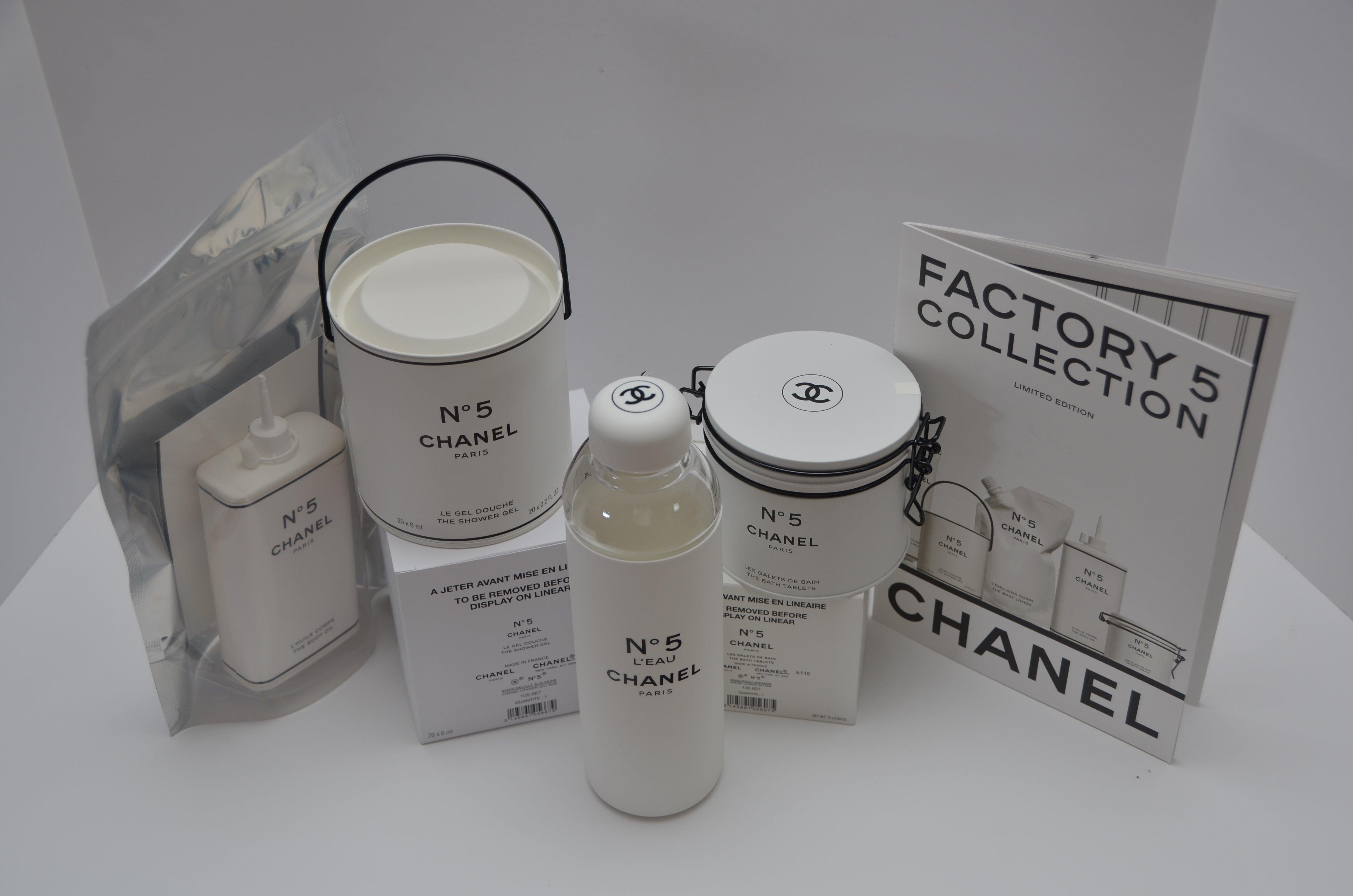 100% guaranteed brand new never used Chanel Factory 5 set total off 4 pieces + booklet that came with this collection 
Please see pictures off whats included in this listing.
Perfect decor for your bathroom.
Water bottle is made of glass and couple
