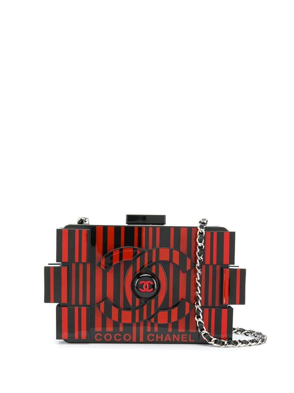 This Limited Edition and extremely sought after Chanel Op-art Lego clutch bag by Karl Lagerfeld is crafted from a combination of Black and red plexiglass. Both exuberant and whimsical, the piece features a distinctive striped barcode design and the