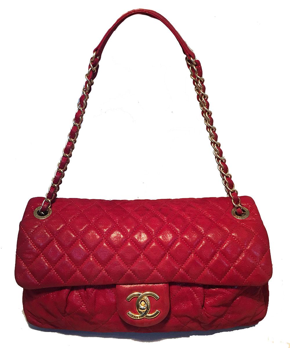 Limited Edition Chanel Red Iridescent Calfskin Chic Quilt Flap Bag in very good condition. Shimmery red quilted calfskin leather exterior trimmed with matte gold hardware. Unique, limited edition pleated front design from the 2011 fall/winter