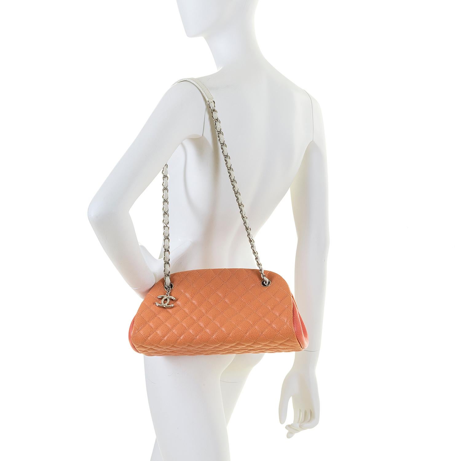 This stunning Limited Edition Chanel 'Just Mademoiselle' shoulder bag is in finished in Peach, Coral and white Caviar calfskin leather. In pristine - 'store-fresh' condition, the bag is beautifully accented with silver-tone hardware, complimented 