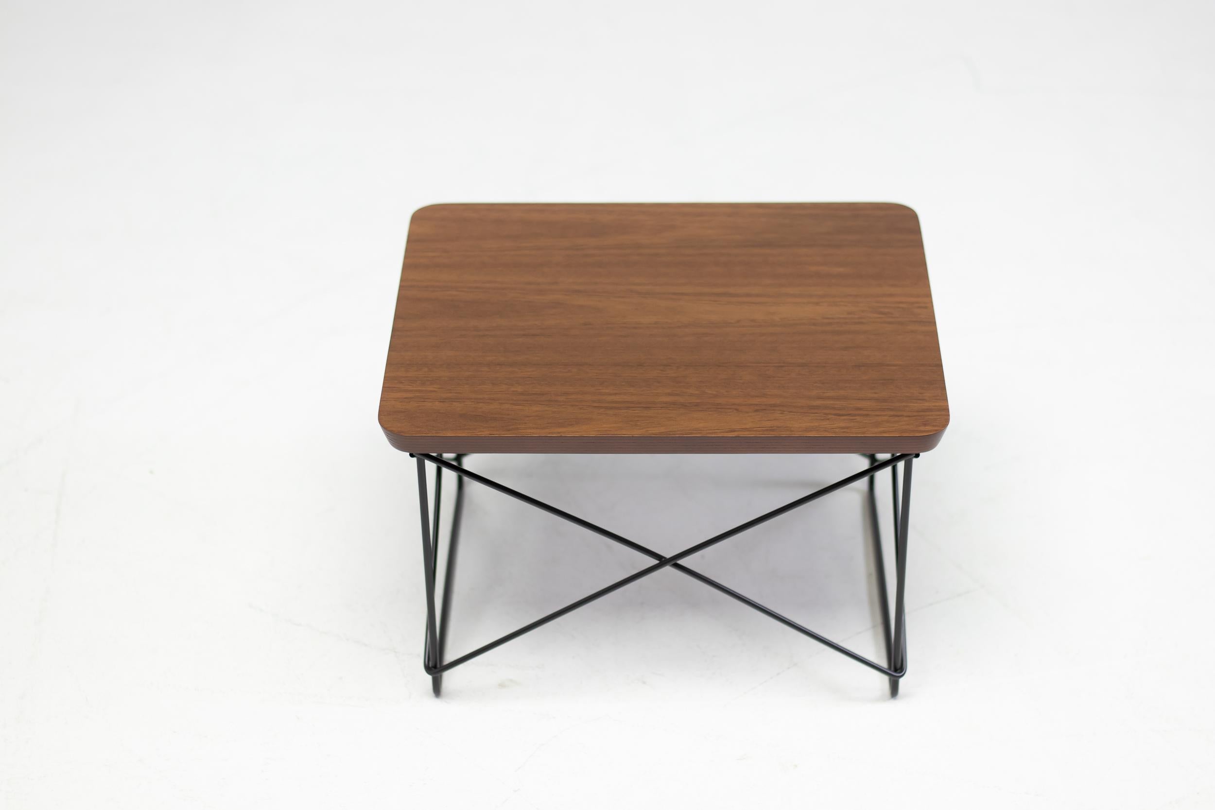 Charles & Ray Eames LTR tables, made by Vitra. Beautiful and exclusive 2018 limited edition sapele wood veneer with black enameled steel base. New old stock, packed in the original box. 
Four available, priced individually.
Signed with a medallion