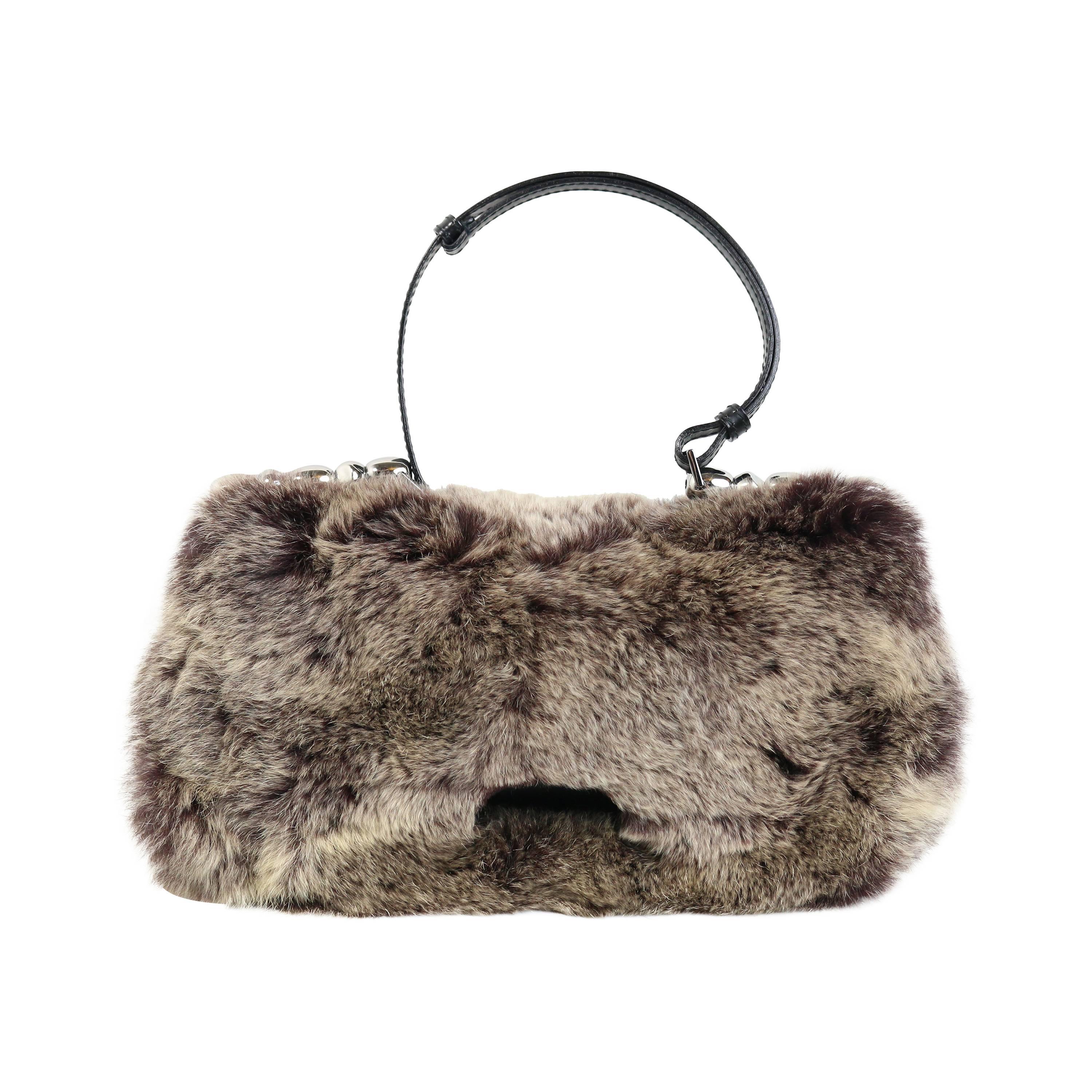 - Limited edition from Fall 2000 Dior by John Galliano single leather strap hobo bag. 

- Front clasp button closure. 

- Front is covered with super soft & luxurious rabbit fur & the back is made up of cloth canvas with silver parallel lines.

-