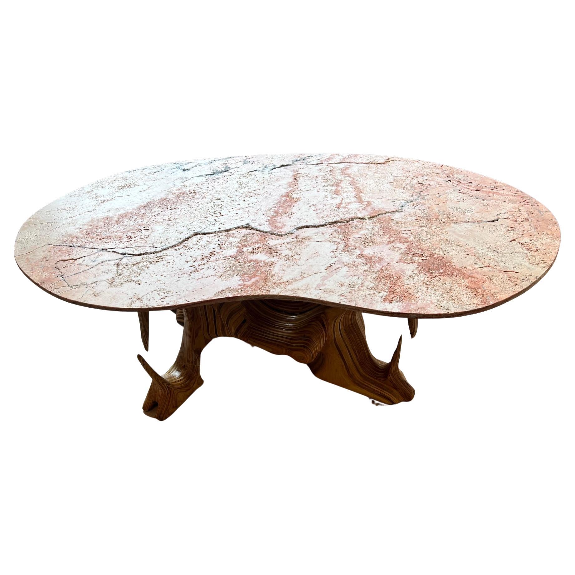Limited Edition coffee table with tumbled Antique Rouge marble top and sculpted base from layered maple plywood