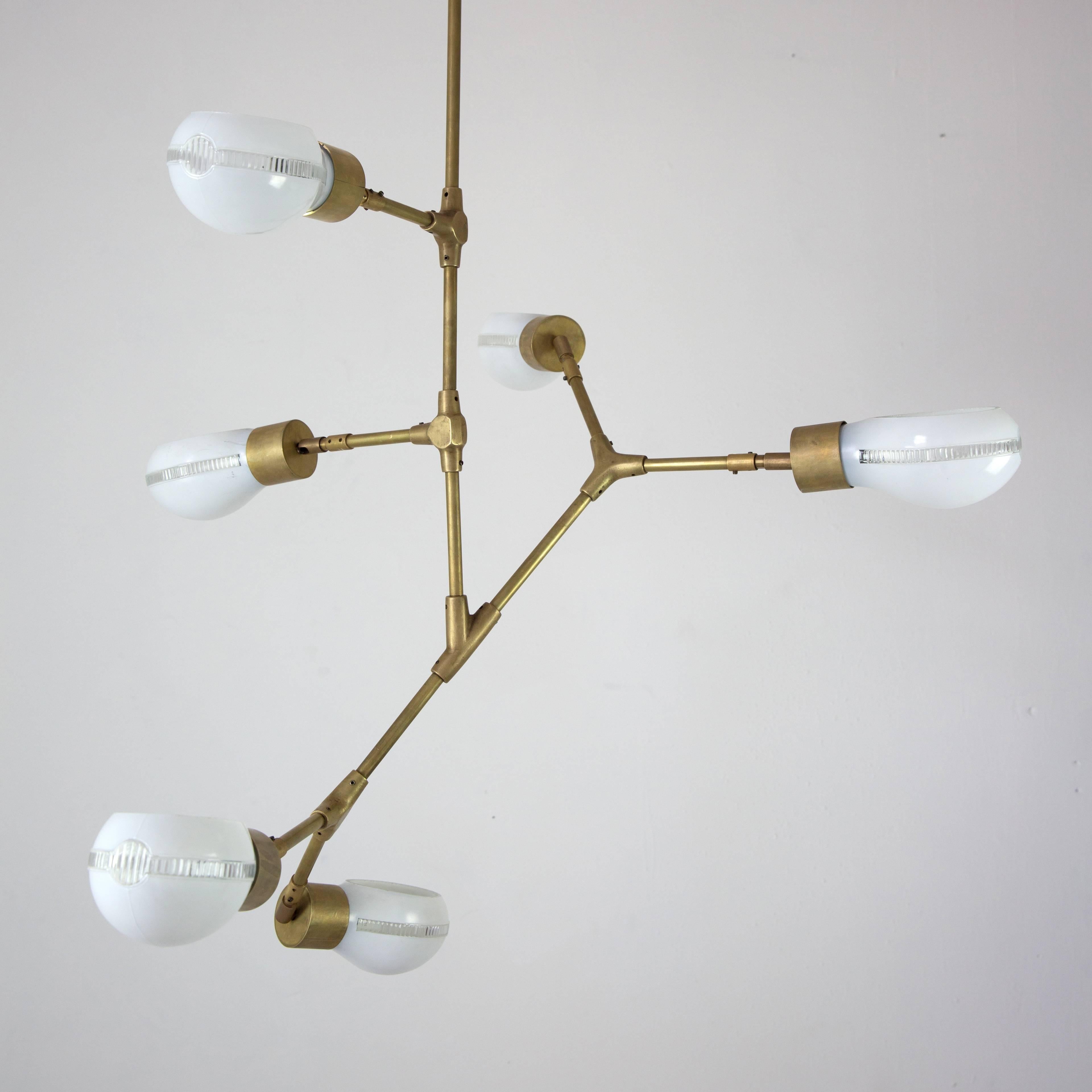 This contemporary pendant lamp design, offered in a limited edition of 12 pieces, is inspired by geometric and organic patterns as well as by industrial style with glass shades from the 1960s.

Designed with handcrafted bronze connections, this