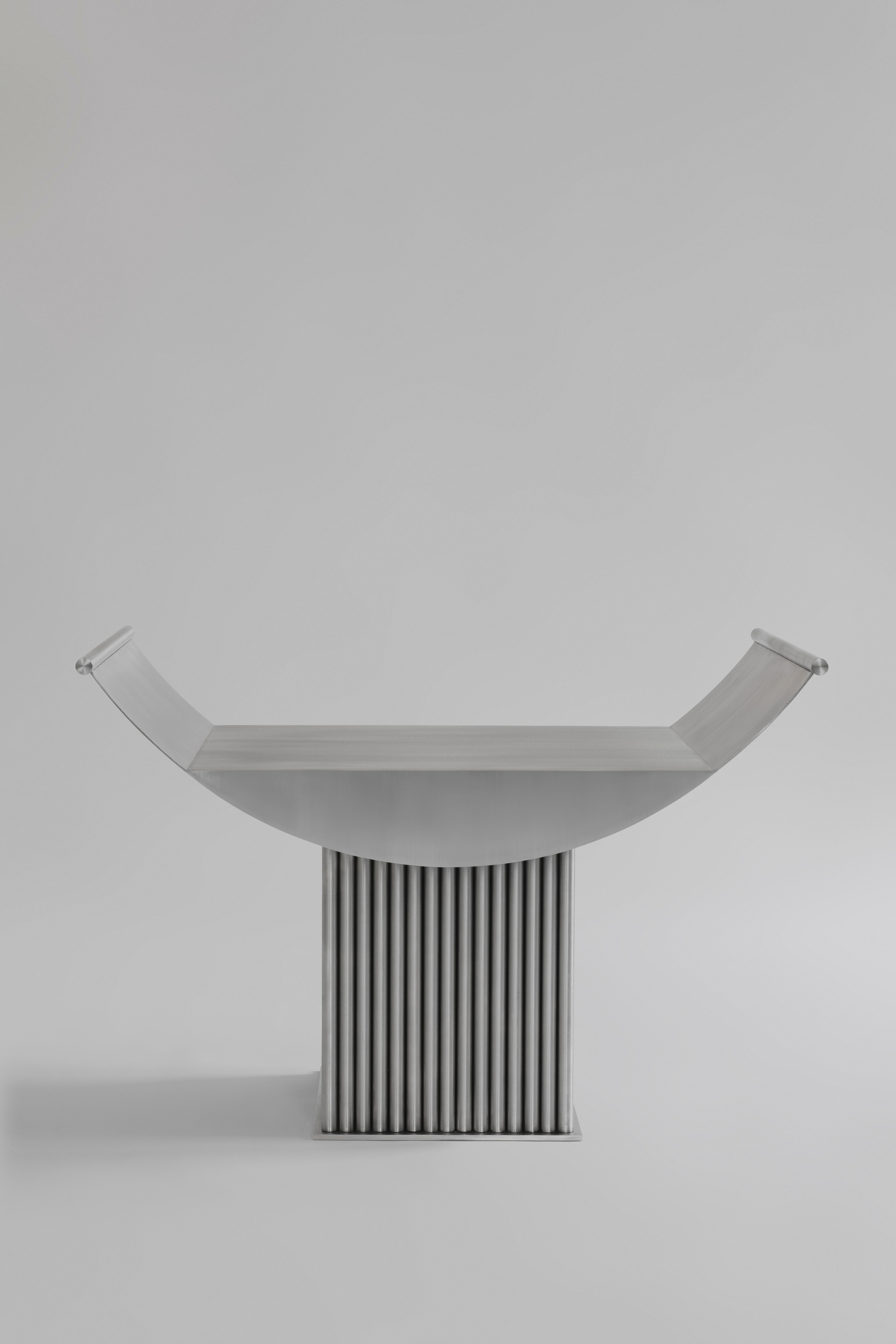 Limited Edition Curule Seat Stool in Stainless Steel by sashaxsasha
Limited Edition of 8 + 2 A.P
Dimensions: D 42 x W 74x H 51 cm. 
Materials: Stainless steel. 

sashaxsasha is a design duo based in Paris, France. Originally from Moscow, Alexandra