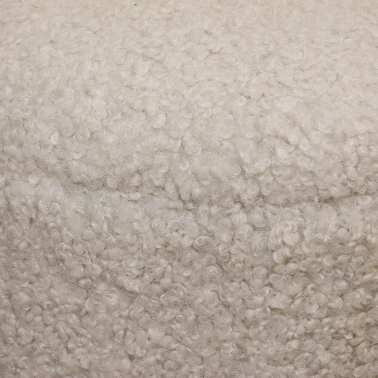 1980s pouf with brand new upholstery in contemporary faux shearling fabric. The pouf was reupholstered to meet today's desired level of comfort. This pouf would look terrific in a living room, family room, library, and anywhere someone may need