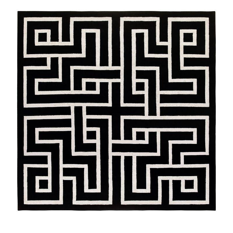 Flaunting a chic contrasting chromatic effect with its black matte yarn and shimmering white bamboo silk, this stunning limited edition rug is a tribute to Daedalus, the mythical Greek creator of the Minotaur's labyrinth. Entirely hand-knotted, the