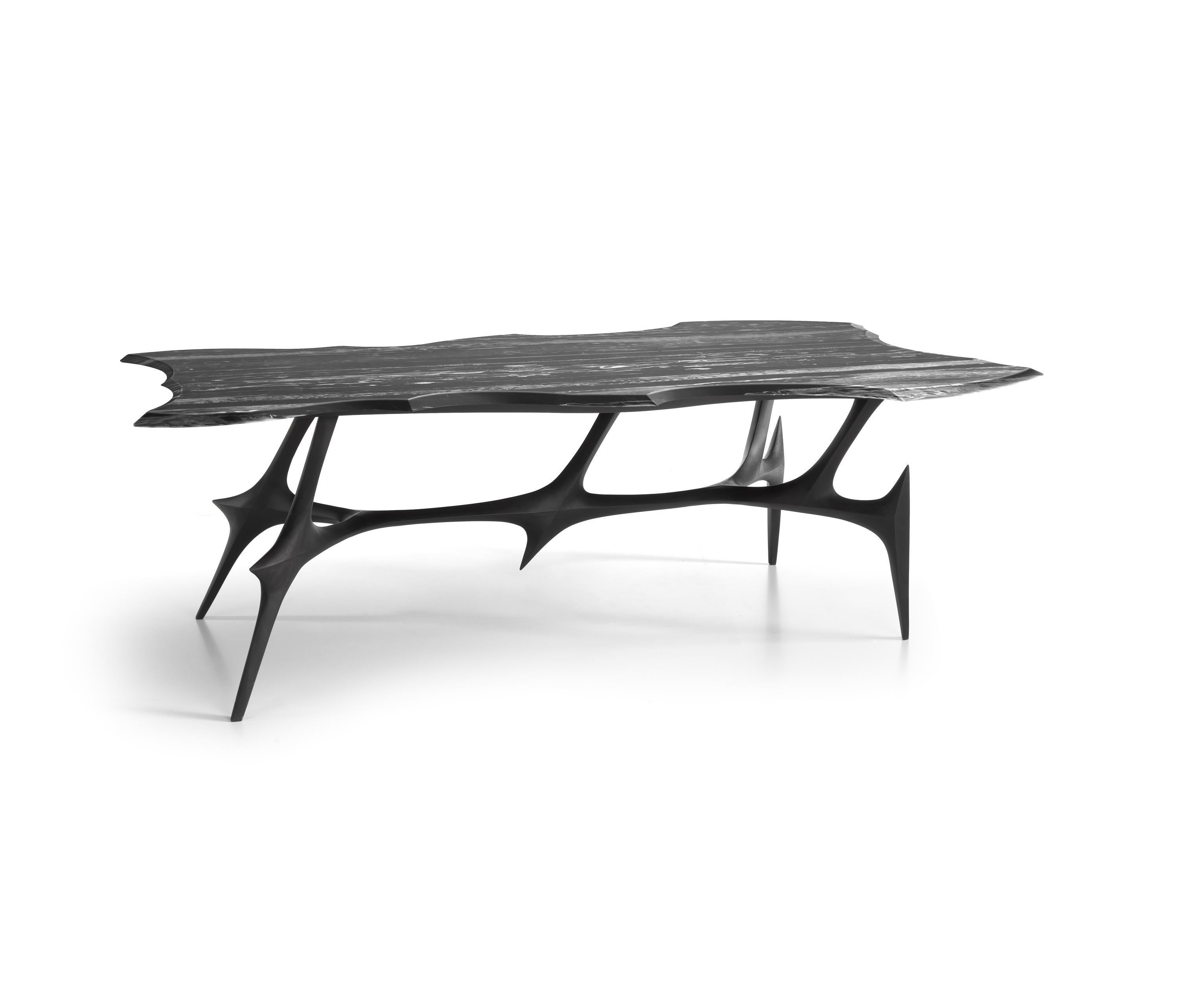 The table design resembles a herald silhouette of a samurai heart. Or maybe.
Beast coupled and ready to jump. No, Its a millennial warrior of pure and petrified blood. This dining table has been designed to win all battles. 
Materials: Solid