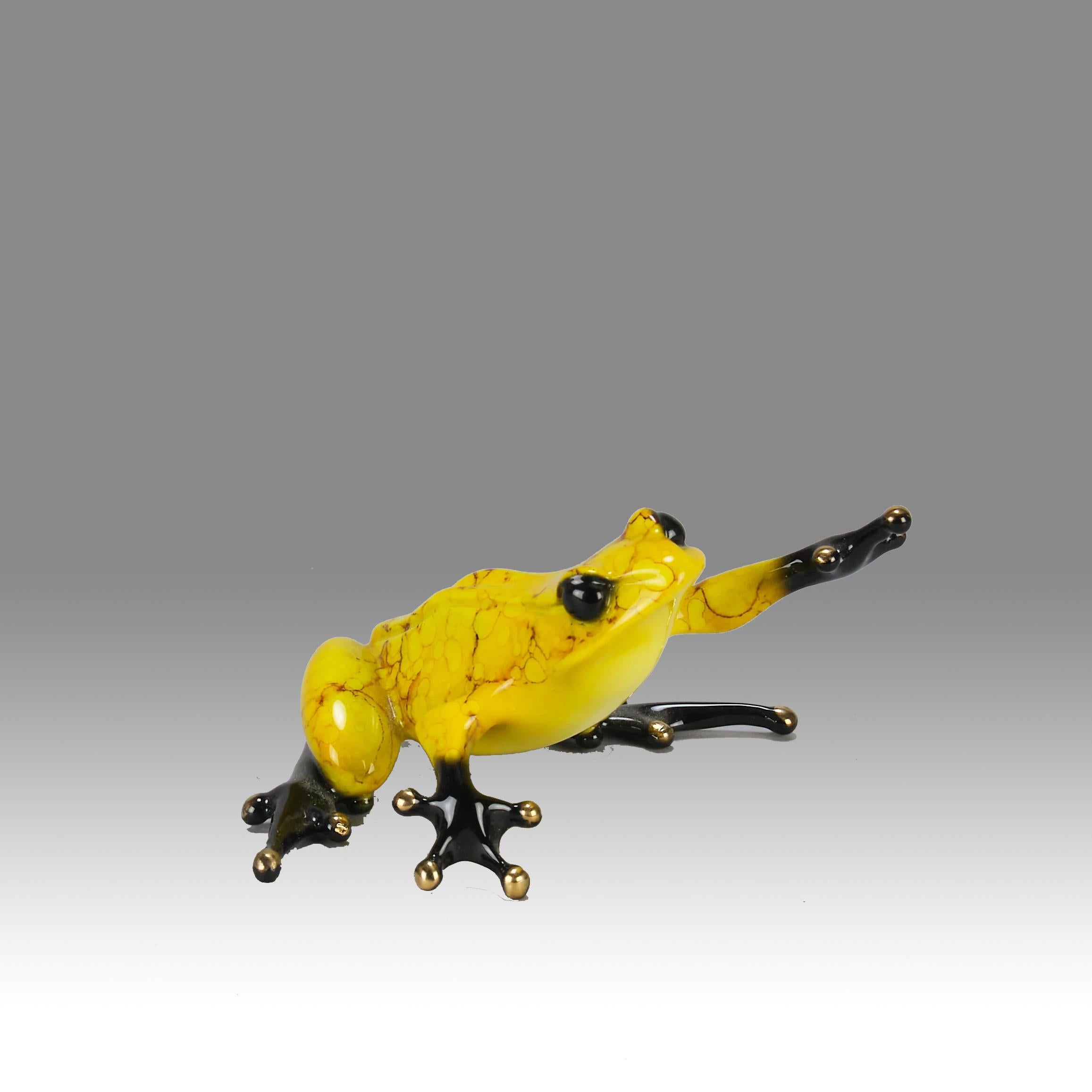 A vibrant limited edition bronze study of a yellow frog with its head raised, reaching out with its front leg, exhibiting very fine bright enamel colours and excellent tactile surface, signed Tim, stamped 'Frogman' and numbered 707/1000