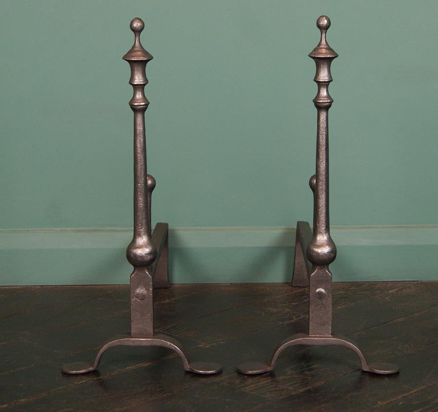 Limited Edition English cast-iron fire dogs. This elegant English design is part of a limited edition series reproduced at Gibilaro Design. The standards with urn finials, rear log-stops and penny feet are finished in black graphite.
S/N: LEOV1690