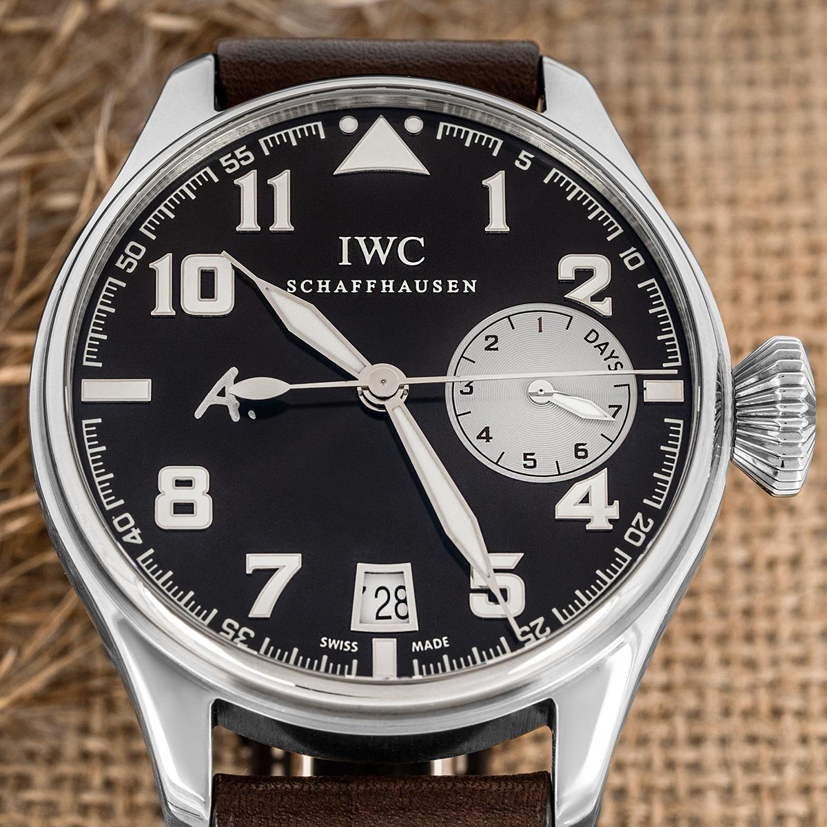 A 46mm IWC Big Pilot Saint Exupery Edition crafted in white gold. Featuring a brown dial with applied arabic numbers, a date display, a power reserve indicator and a fixed white gold bezel. Fitted with a sapphire and powered by an automatic