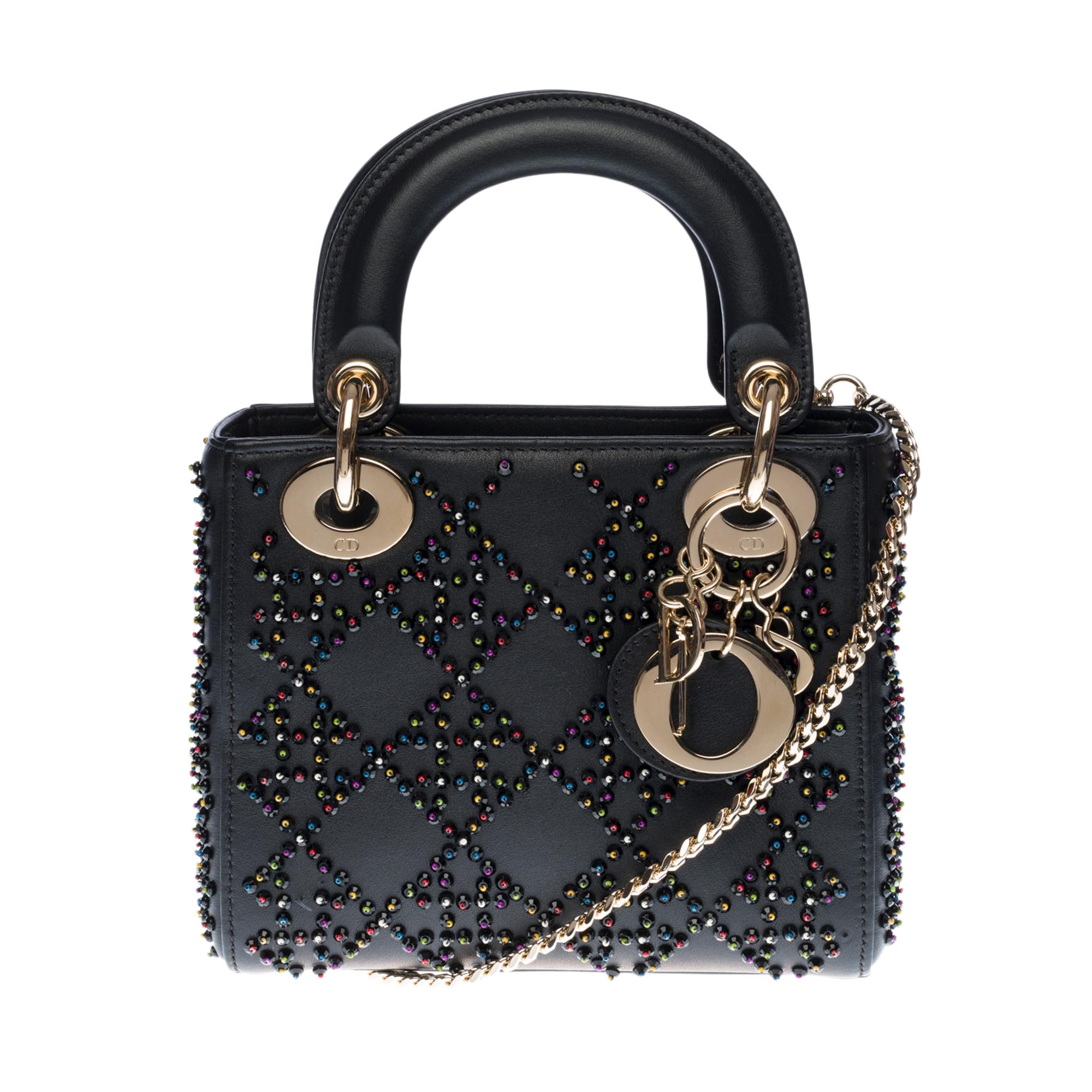 The Lady Dior Mini bag embodies the classic elegance combined with the modernity of Dior. This limited edition creation is made of black lamb leather, embroidered with facetted beads enhanced with colorful beads, drawing the emblematic Cannage