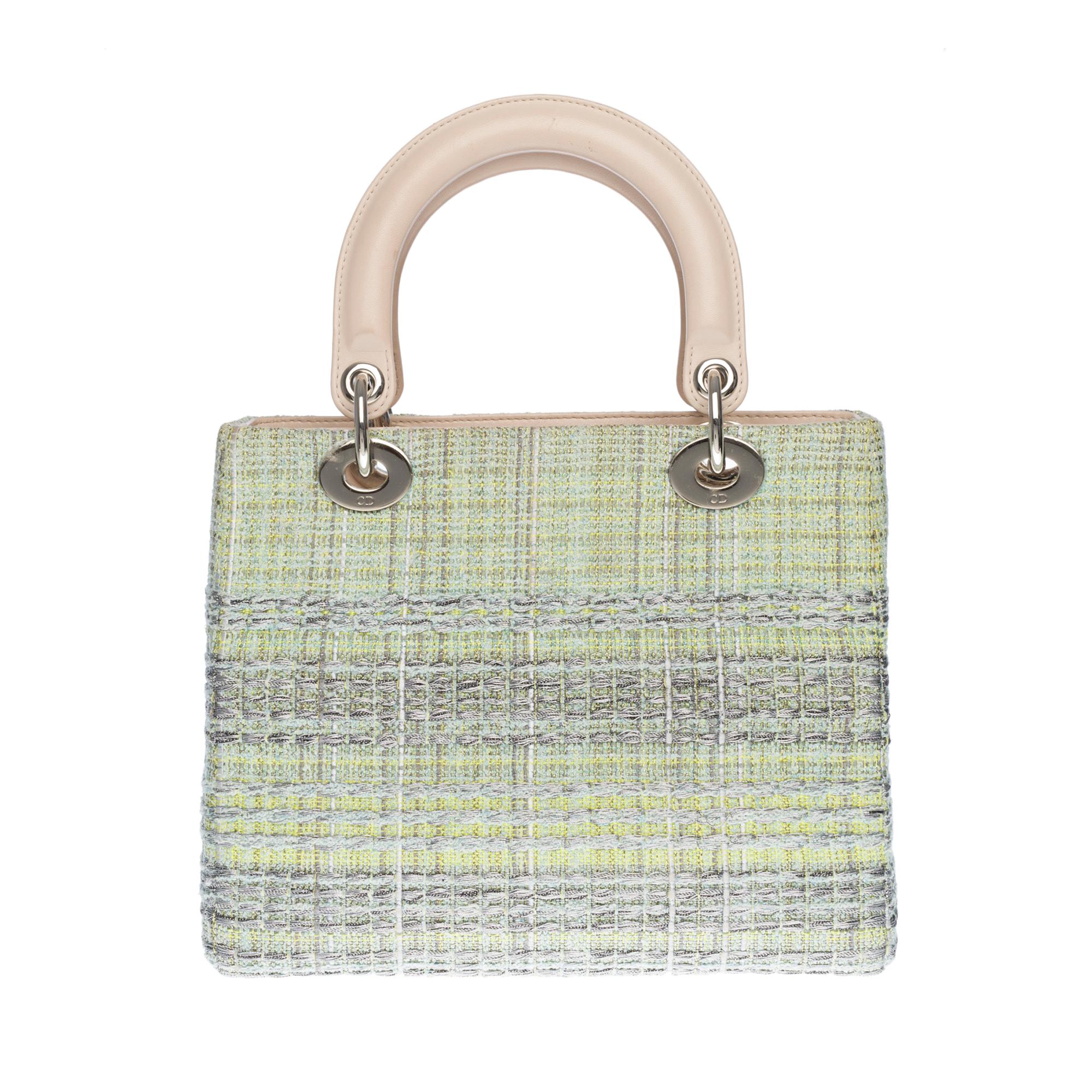 The Lady Dior bag embodies classic elegance combined with the modernity of the House of Dior. This creation is entirely embroidered with the green Tweed pattern embroidered with silver threads, featuring the Maison’s iconic motif through a play of