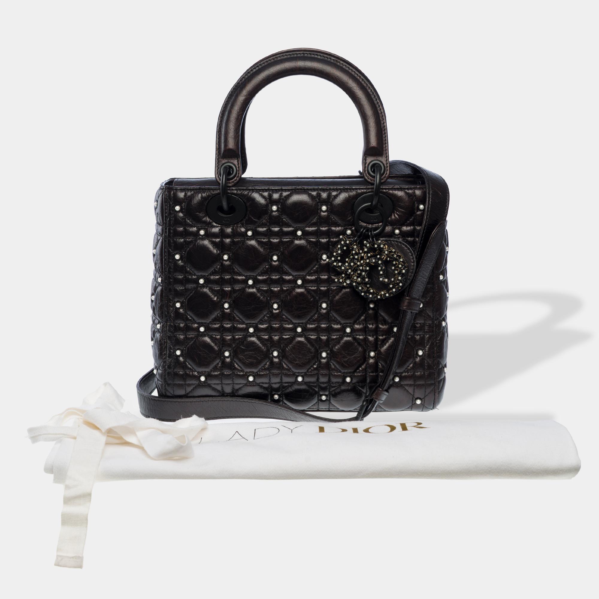 Exceptional​ ​and​ ​rare​ ​Dior​ ​Lady​ ​Dior​ ​Medium​ ​handbag​ ​strap​ ​in​ ​black​ ​crackled​ ​lambskin​ ​with​ ​white​ ​pearls,​ ​blackened​ ​metal​ ​trim,​ ​double​ ​black​ ​leather​ ​handle,​ ​removable​ ​black​ ​leather​ ​strap​ ​for​