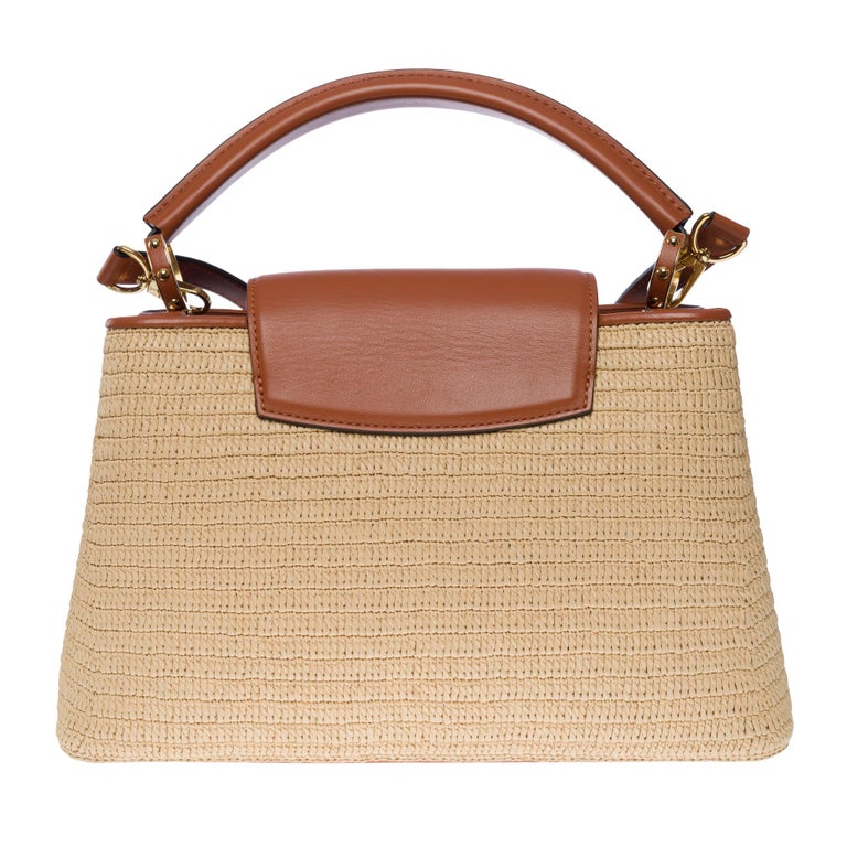 Obsessed with this raffia and leather Capucines bag