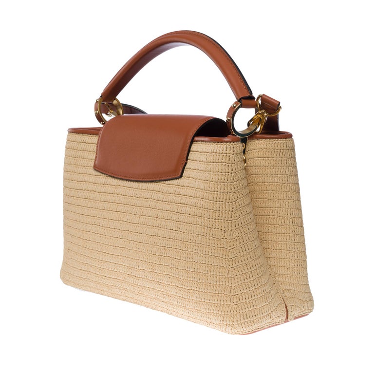 Obsessed with this raffia and leather Capucines bag