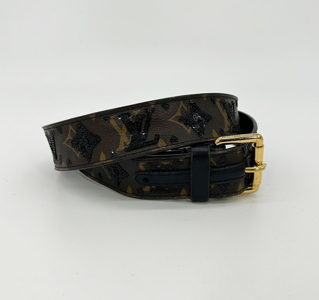 Limited Edition Louis Vuitton Monogram Sequin Eclipse Belt in excellent condition. Signature monogram LV canvas trimmed with black sequins throughout. Golden brass buckle engraved with Louis Vuitton. Black lambskin leather back lining. 90cm size.