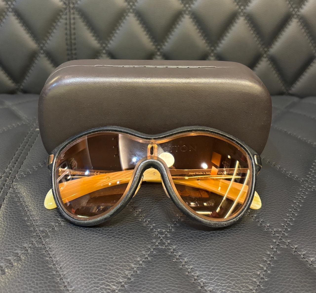Unique limited edition lv sunglasses. Minor scuffs on the handles and glasses. In good condition overall. Unique piece, can be worn as ski glasses. Comes with the case only.
