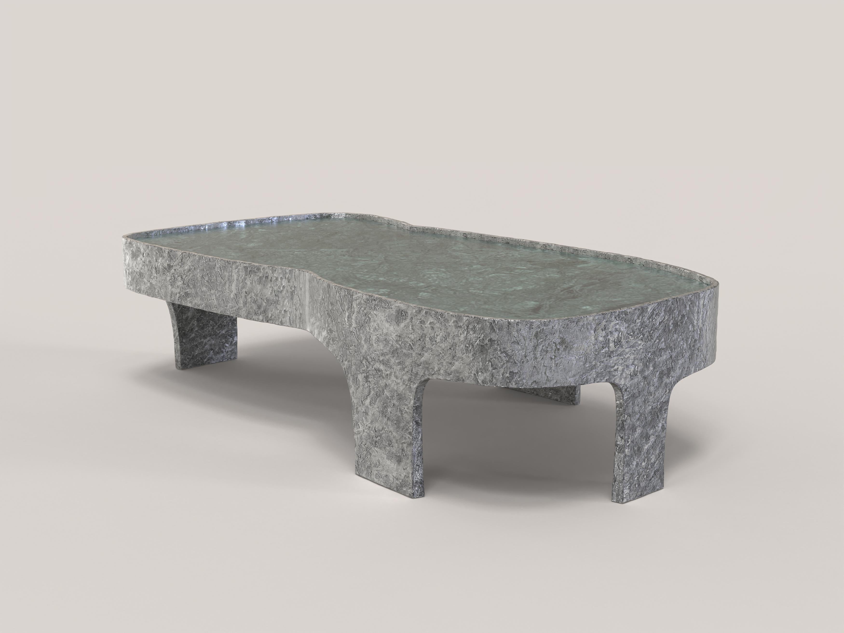 Sumatra V3 is a 21st Century low table made by Italian artisans in aluminium with an extraordinary green Guatemala marble plane. It is part of the collectible design language Sumatra that has been developed by the Edizione Limitata's art research