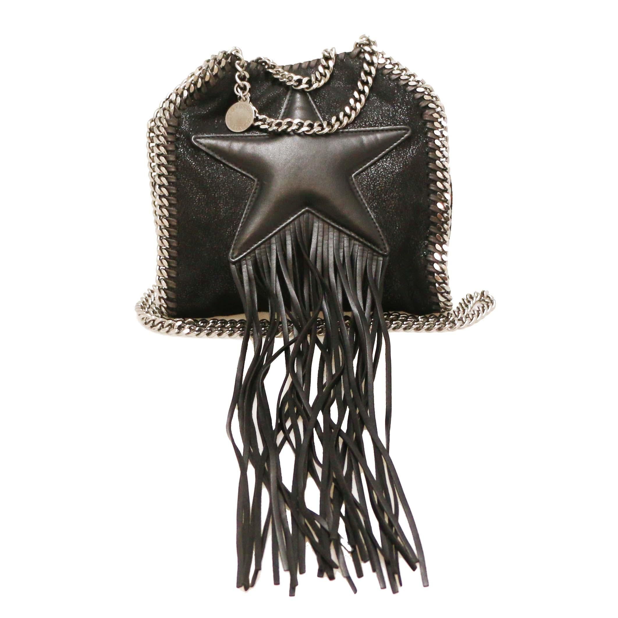 Very good condition 
Made in Italy
Material: suede leather, smooth
Colour: black
Dimensions: 18 x 19 x 6 cm
Handles: hand-held
Shoulder strap: total length 106 cm
Jewellery: silver metal
Magnetic pressure
Leather fringes
Lining: pink monogram