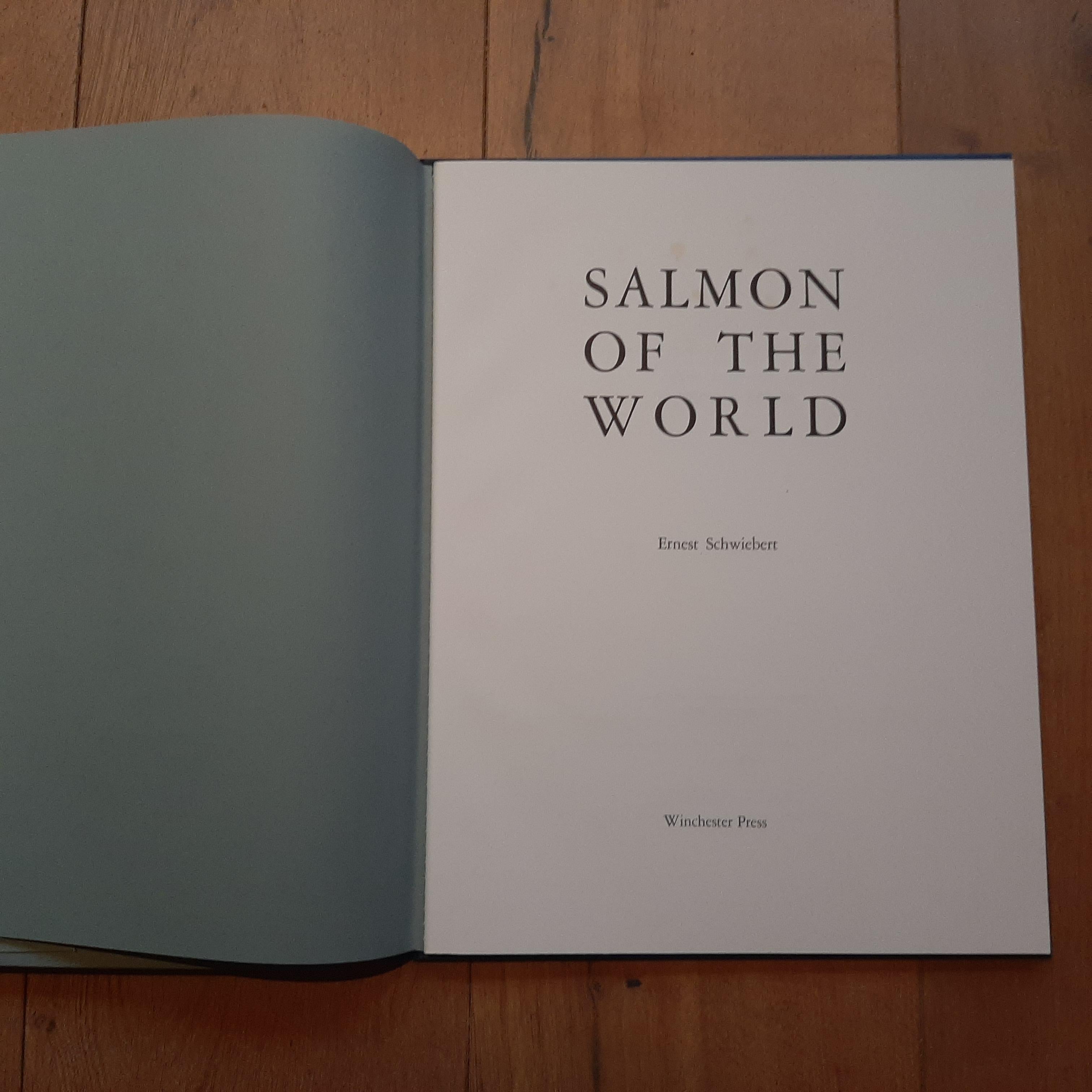 'Salmon of the World' by Ernest Schwiebert. A portfolio of 30 color plates on the left side, in folding paper chemise. Text on the right, in the form of a 63 page book. Hardcover with gold lettering on the spine with original slipcase. Limited