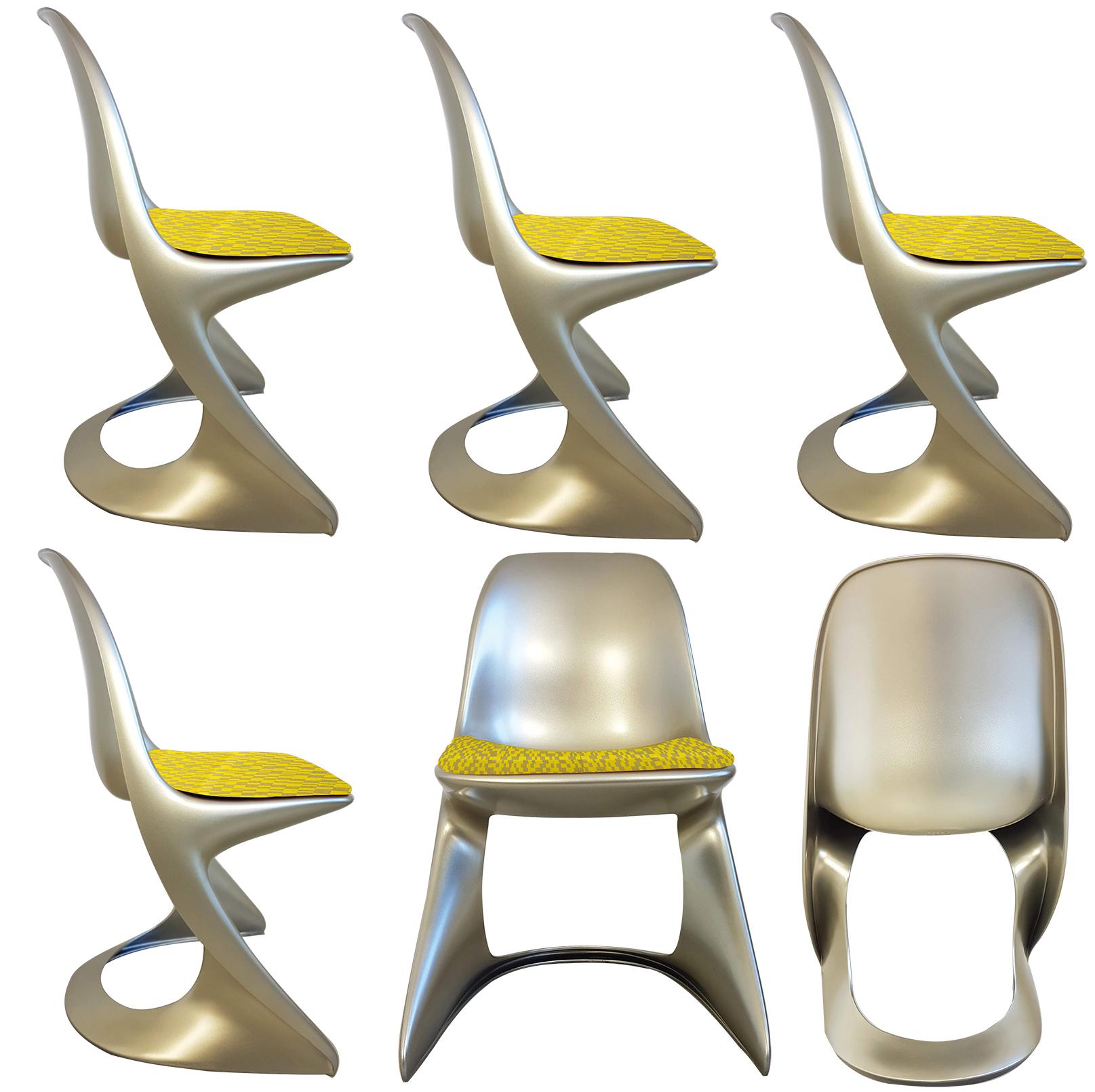Unusual set of Ostergaard polyethylene in lacquered metallic color made by rotational molding fixed (indoor/outdoor use) chairs with new seats made of geometric woven jacquard textile fabric 