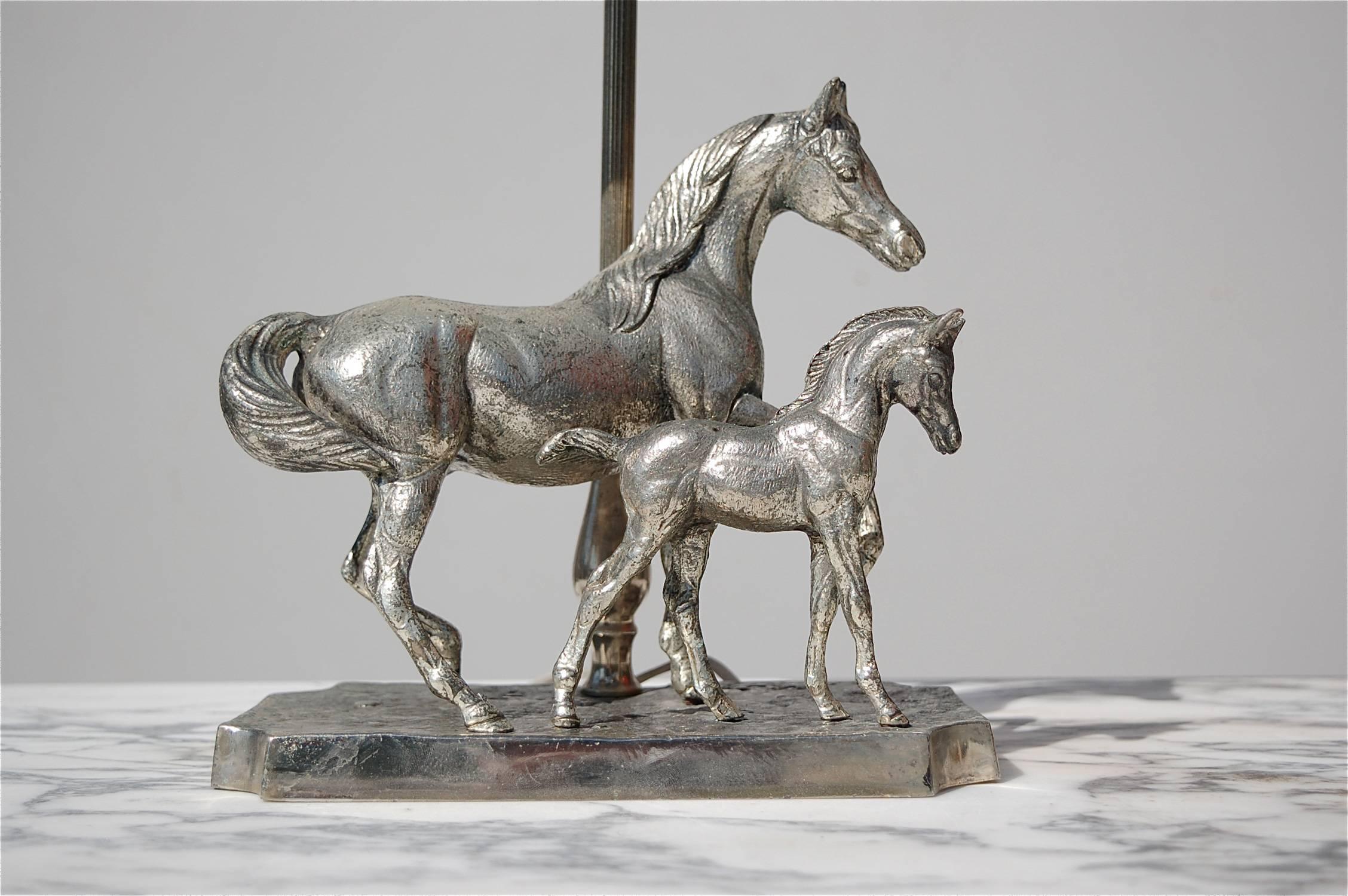 Silver plated table lamp featuring a horse, a merry with a young foal dating from the early 1980s. Underside of the base is numbered 499/500. The silver finish could be polished but as this would take away the lovely patina that's developed over the