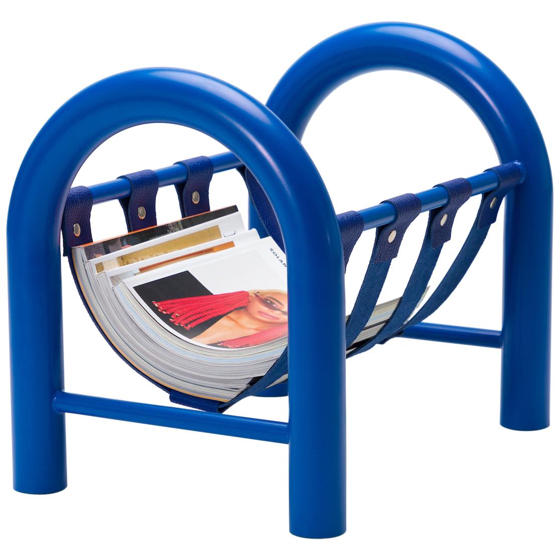 The tubular magazine rack is a lightweight yet durable magazine rack perfect for holding any reading materials you want at the ready, while injecting a sense of thoughtful design into a space.

This limited edition blue frame with blue leather